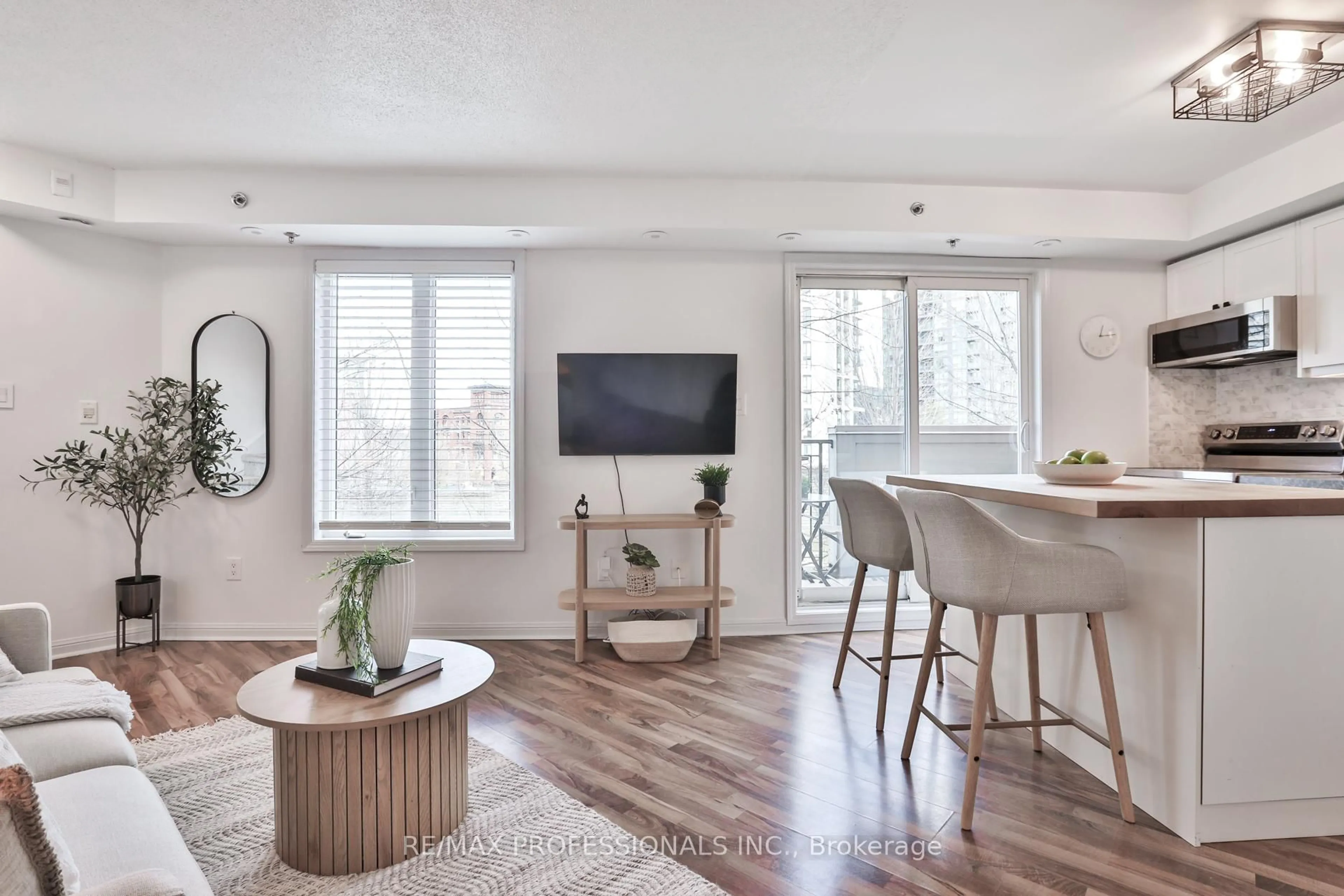 Living room with furniture, wood/laminate floor for 80 Joe Shuster Way #1706, Toronto Ontario M6K 1Y5