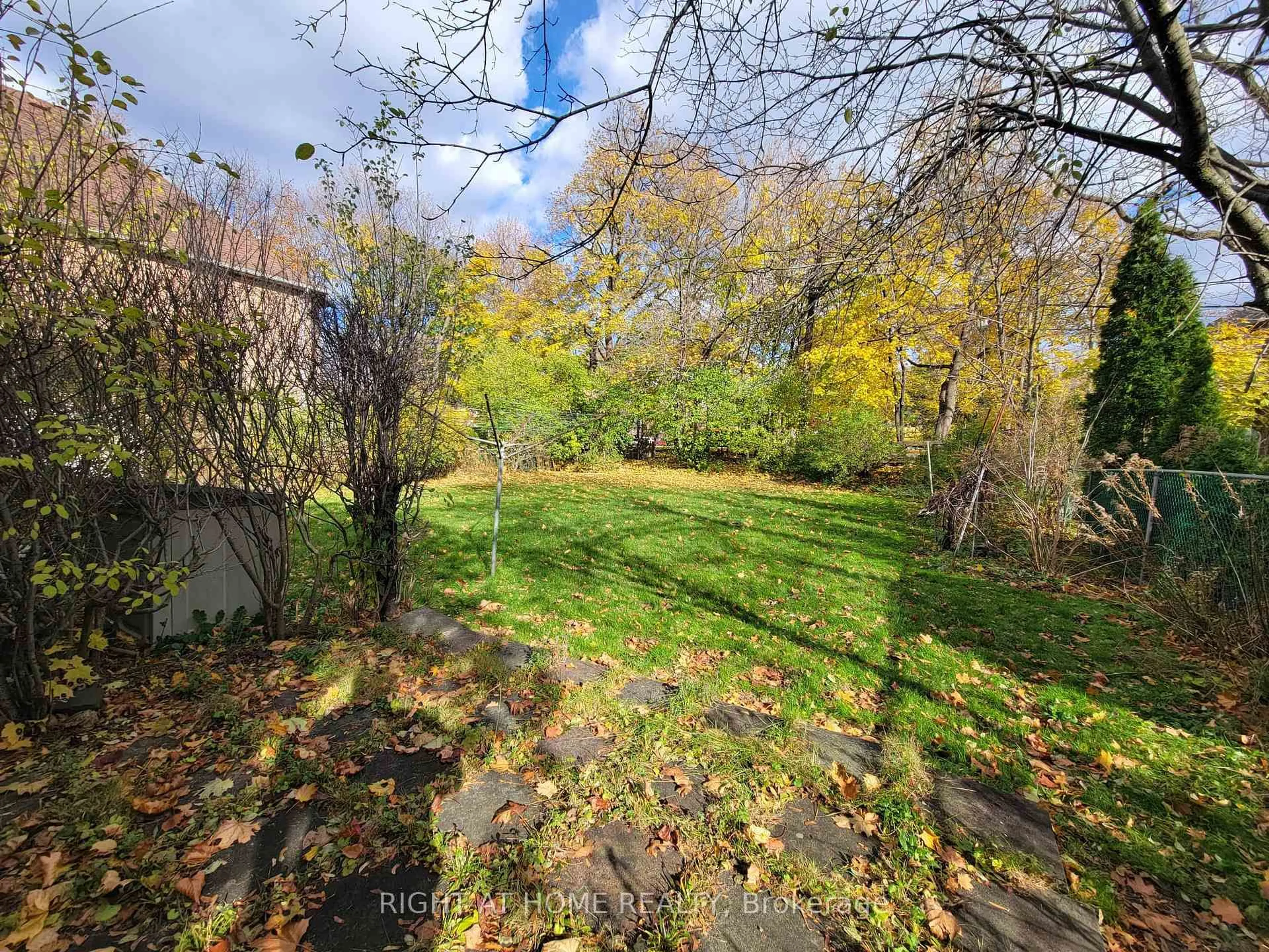 A pic from outside/outdoor area/front of a property/back of a property/a pic from drone, forest/trees view for 15 Blaketon Rd, Toronto Ontario M9B 4V8