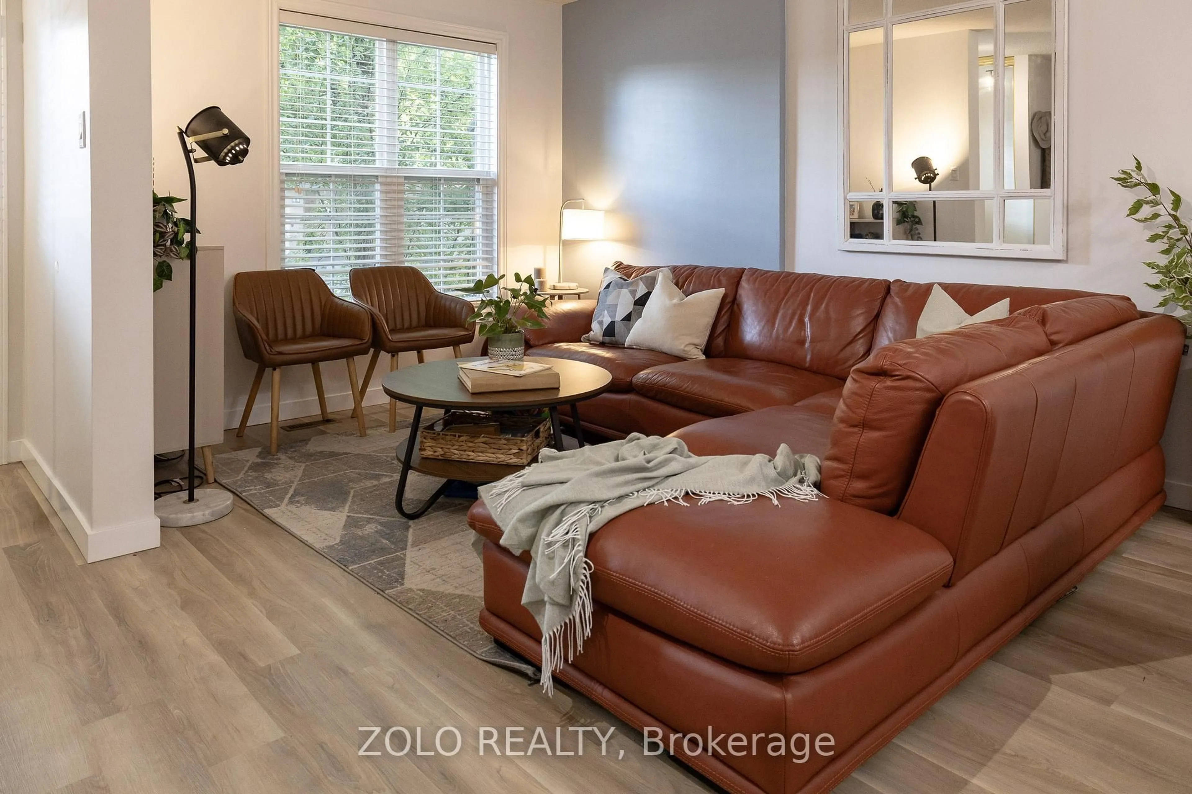 Living room with furniture, wood/laminate floor for 2272 Mowat Ave #45, Oakville Ontario L6H 5L8