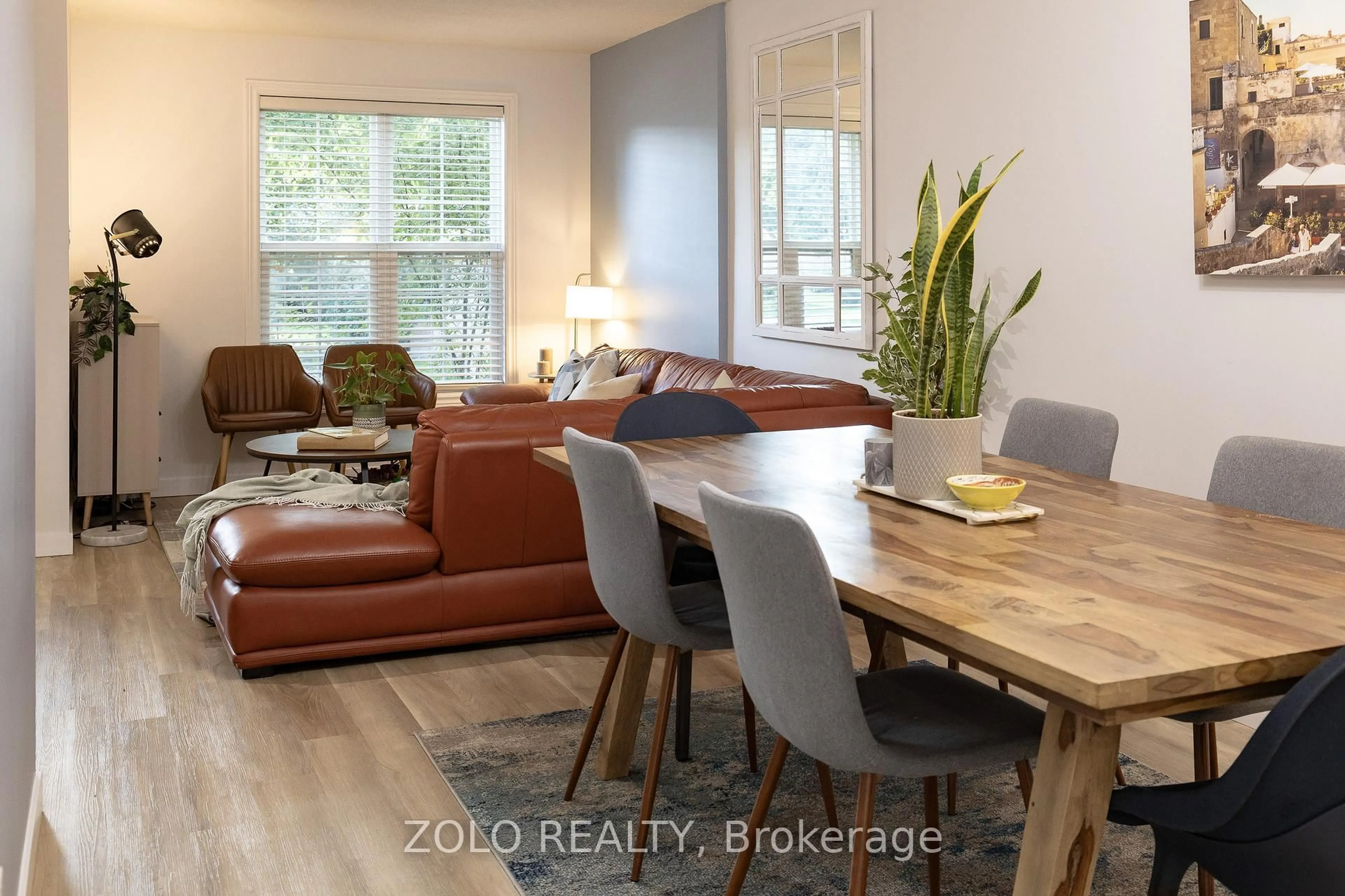 Living room with furniture, wood/laminate floor for 2272 Mowat Ave #45, Oakville Ontario L6H 5L8