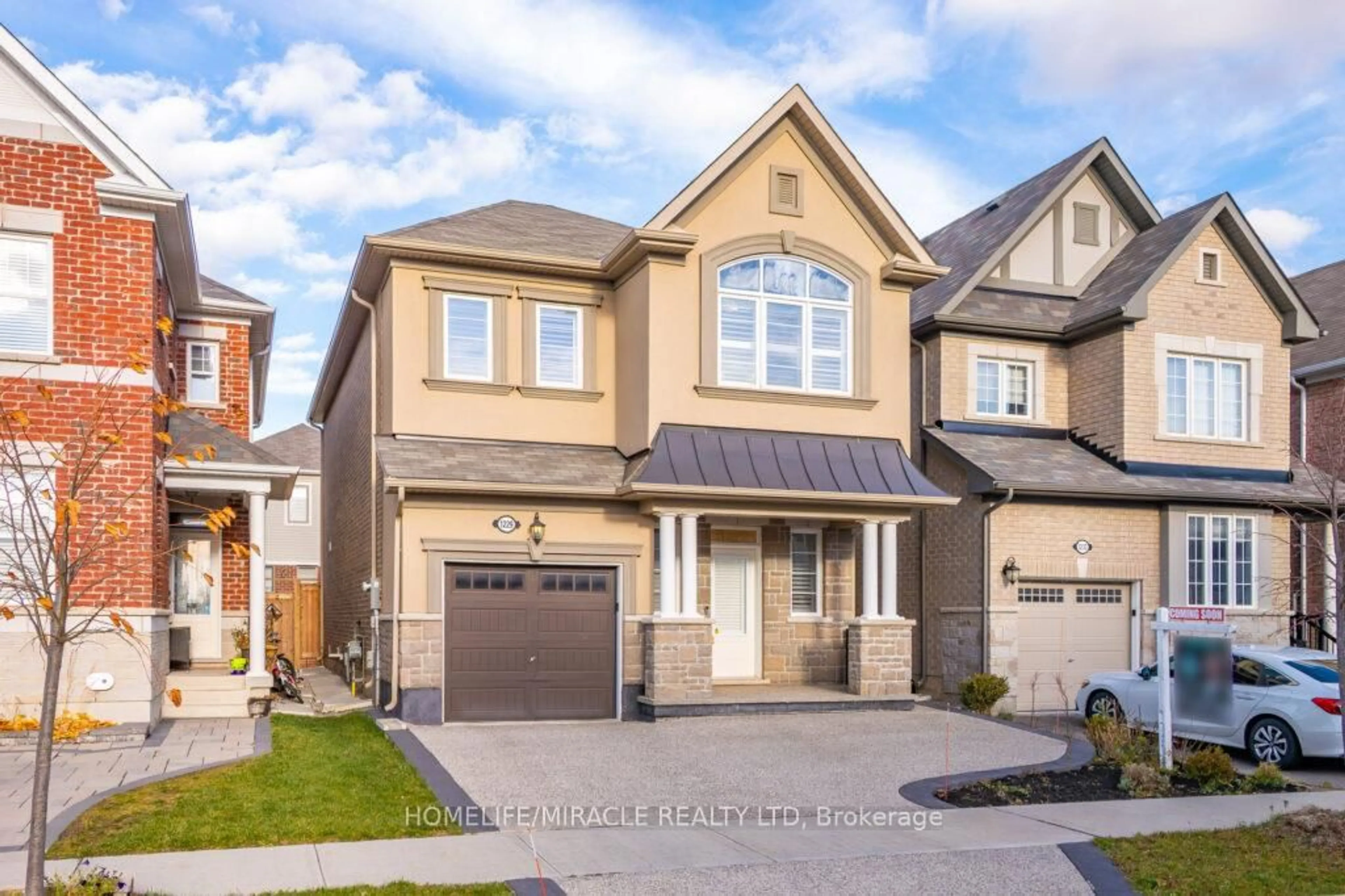 Home with brick exterior material, street for 1229 Rose Way, Milton Ontario L9T 7E7