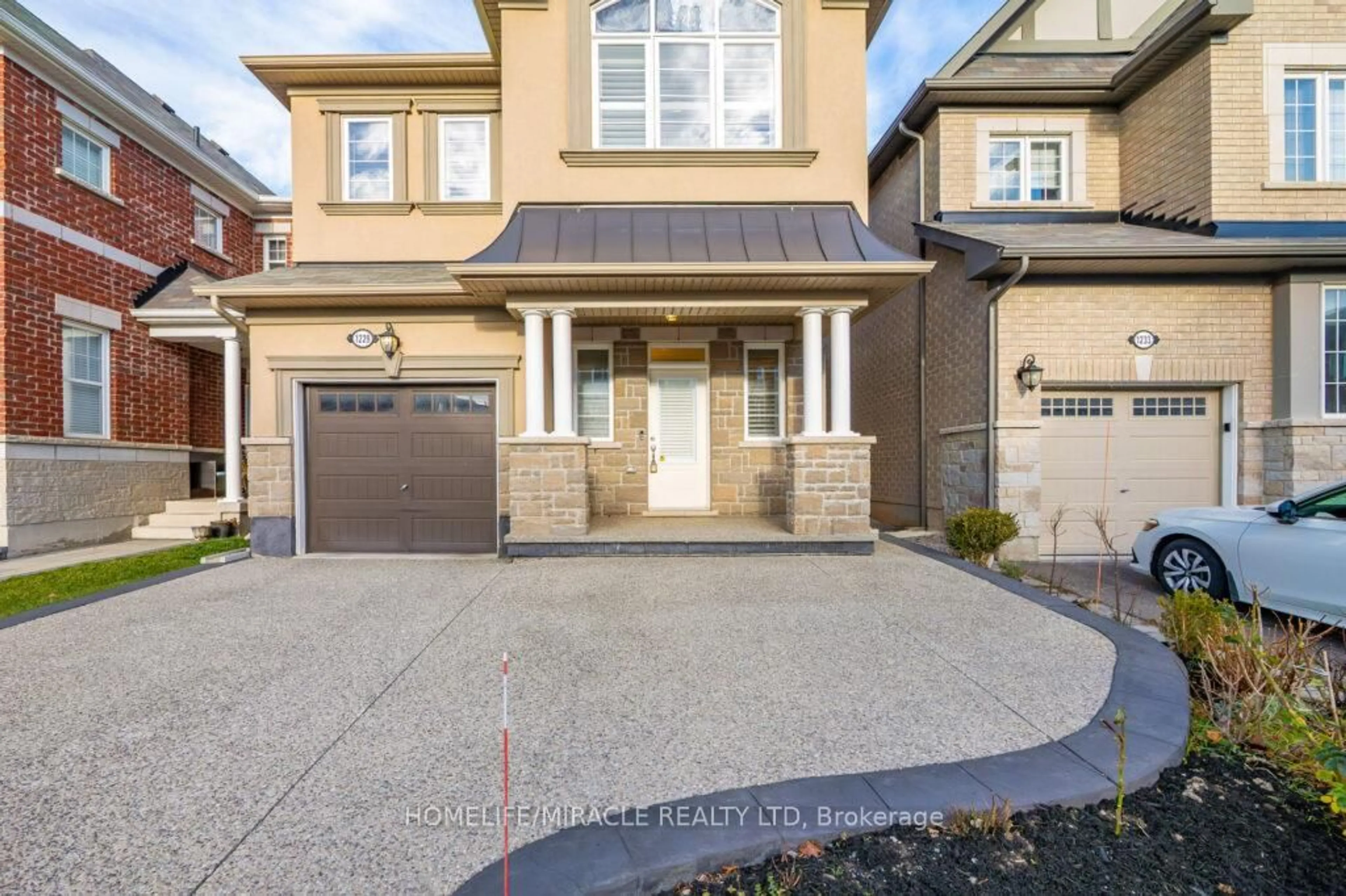 Home with brick exterior material, street for 1229 Rose Way, Milton Ontario L9T 7E7