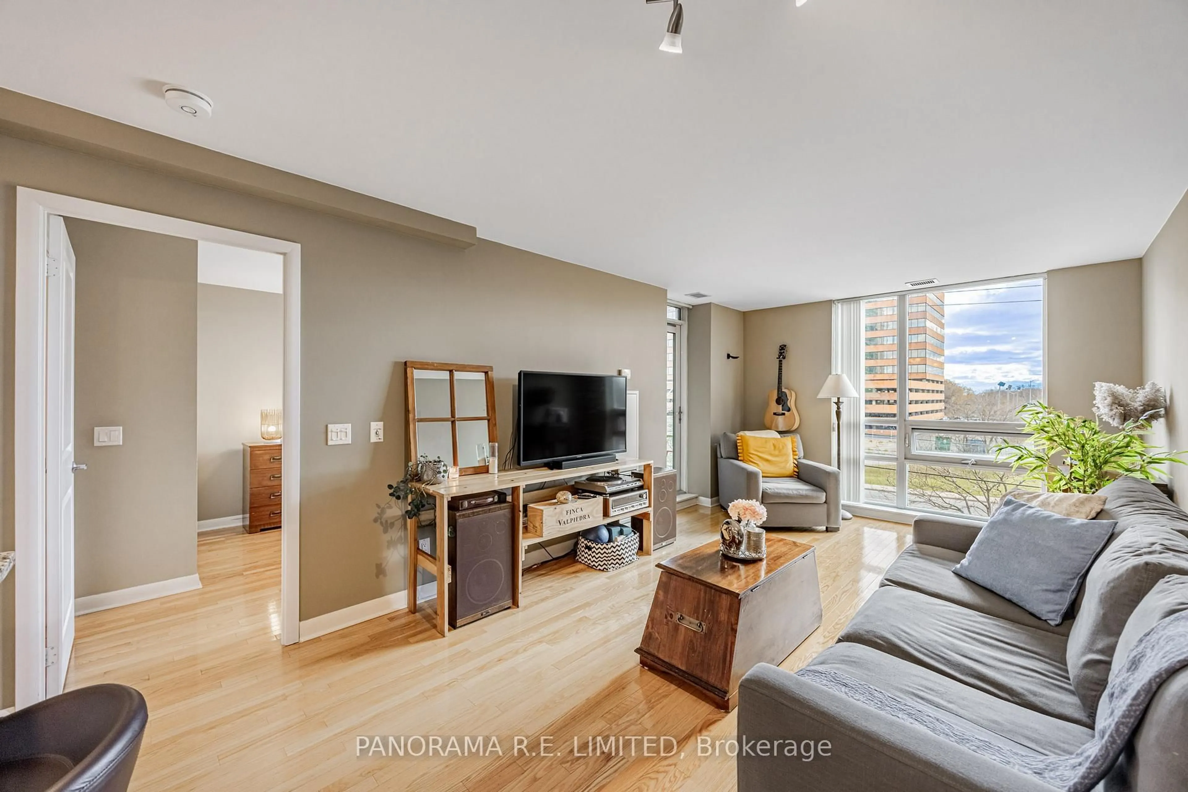 Living room with furniture, wood/laminate floor for 225 Sherway Gardens Rd #310, Toronto Ontario M9C 0A3