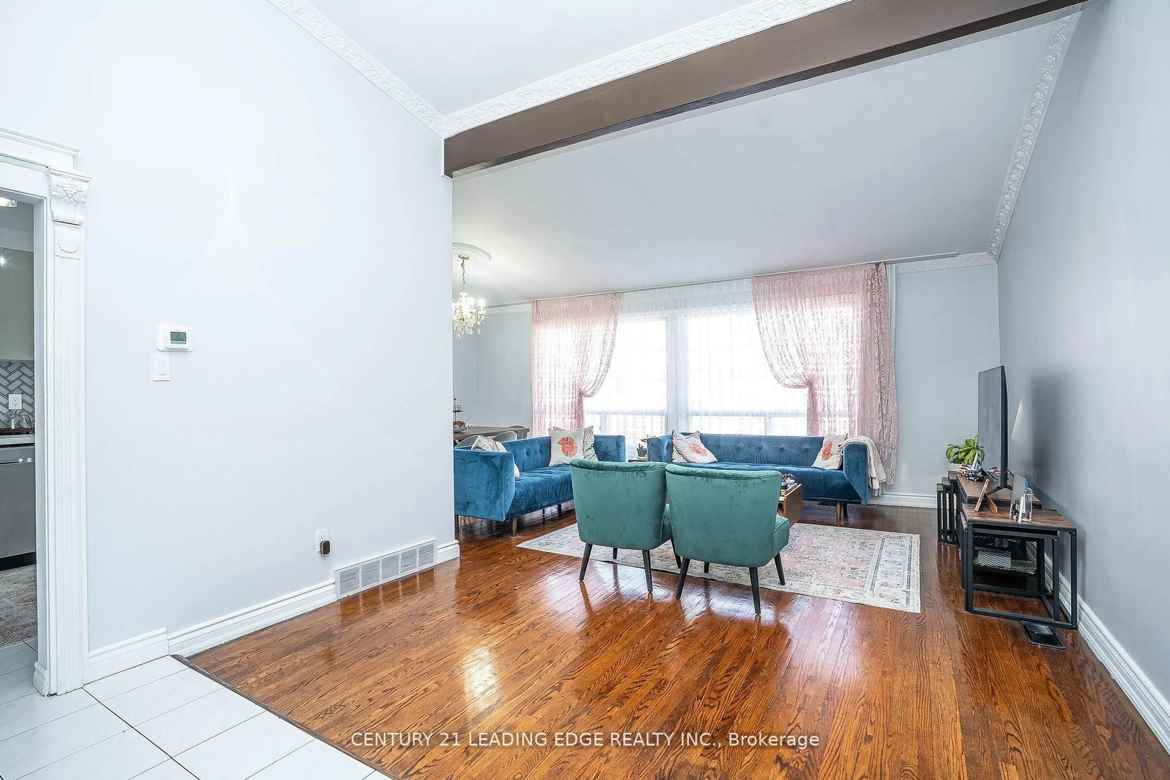 Living room with furniture, wood/laminate floor for 21 Alhart Dr, Toronto Ontario M9V 2M8