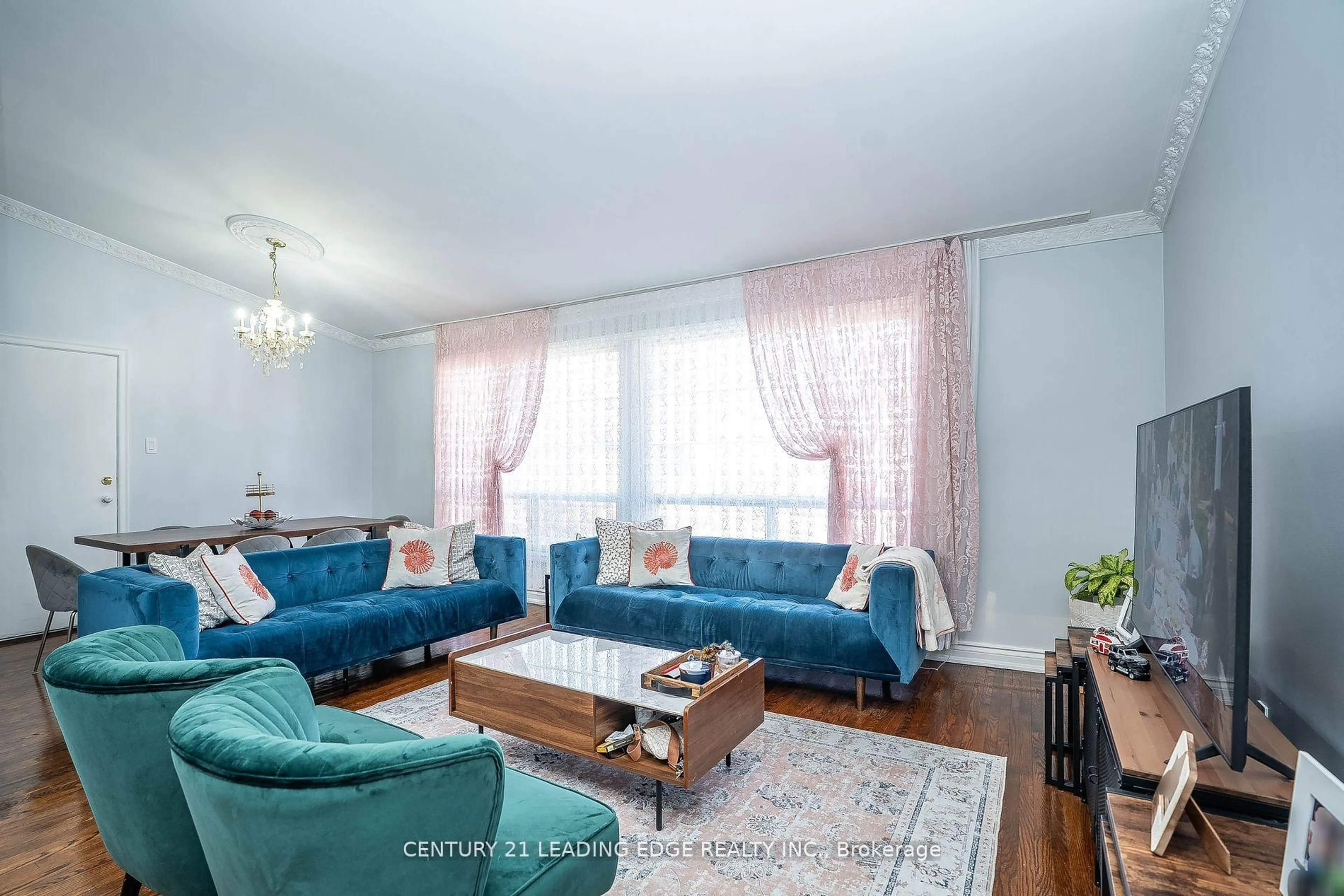 Living room with furniture, wood/laminate floor for 21 Alhart Dr, Toronto Ontario M9V 2M8