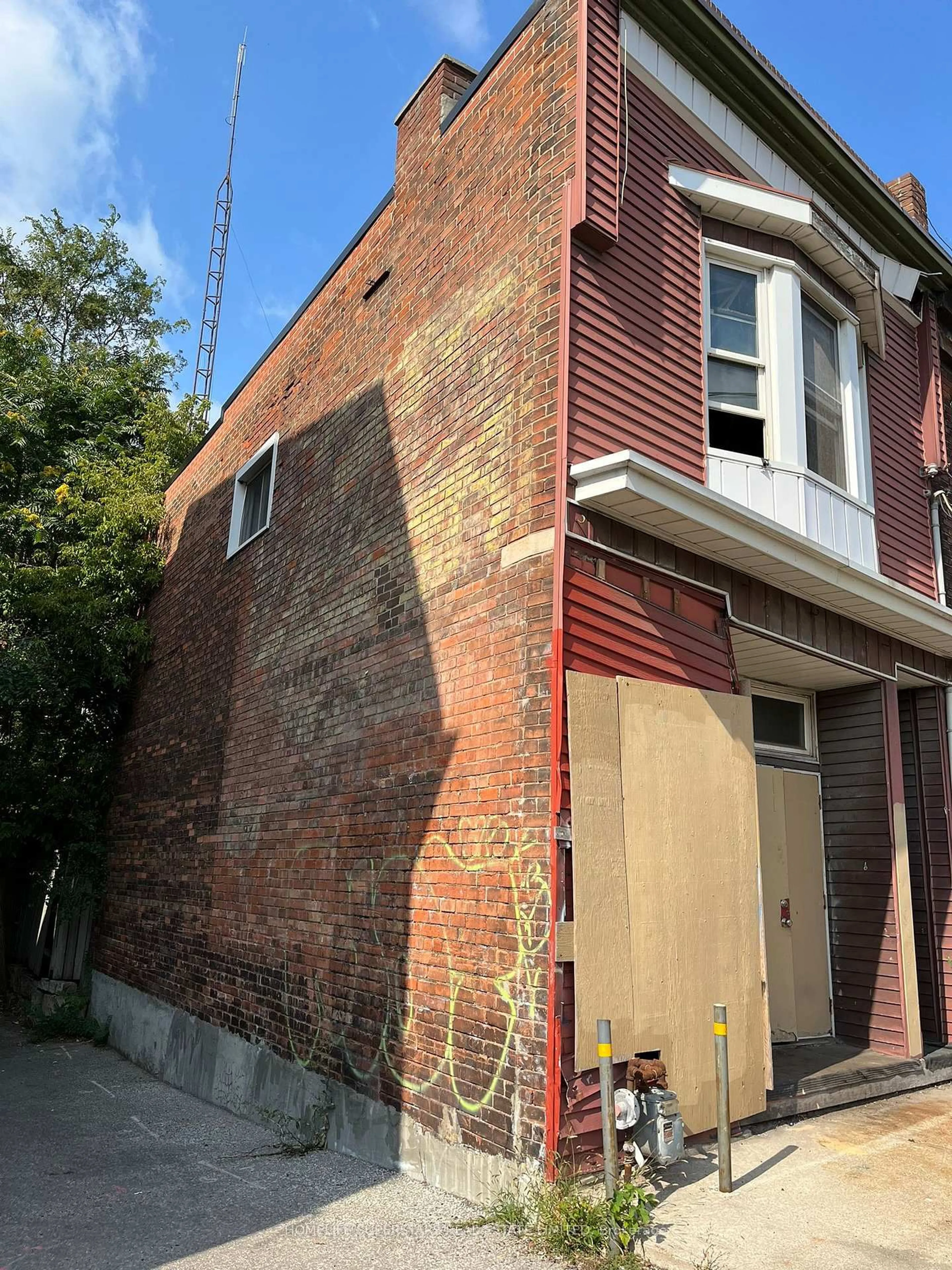 Home with brick exterior material, building for 2553 Dundas St, Toronto Ontario M6P 1X6