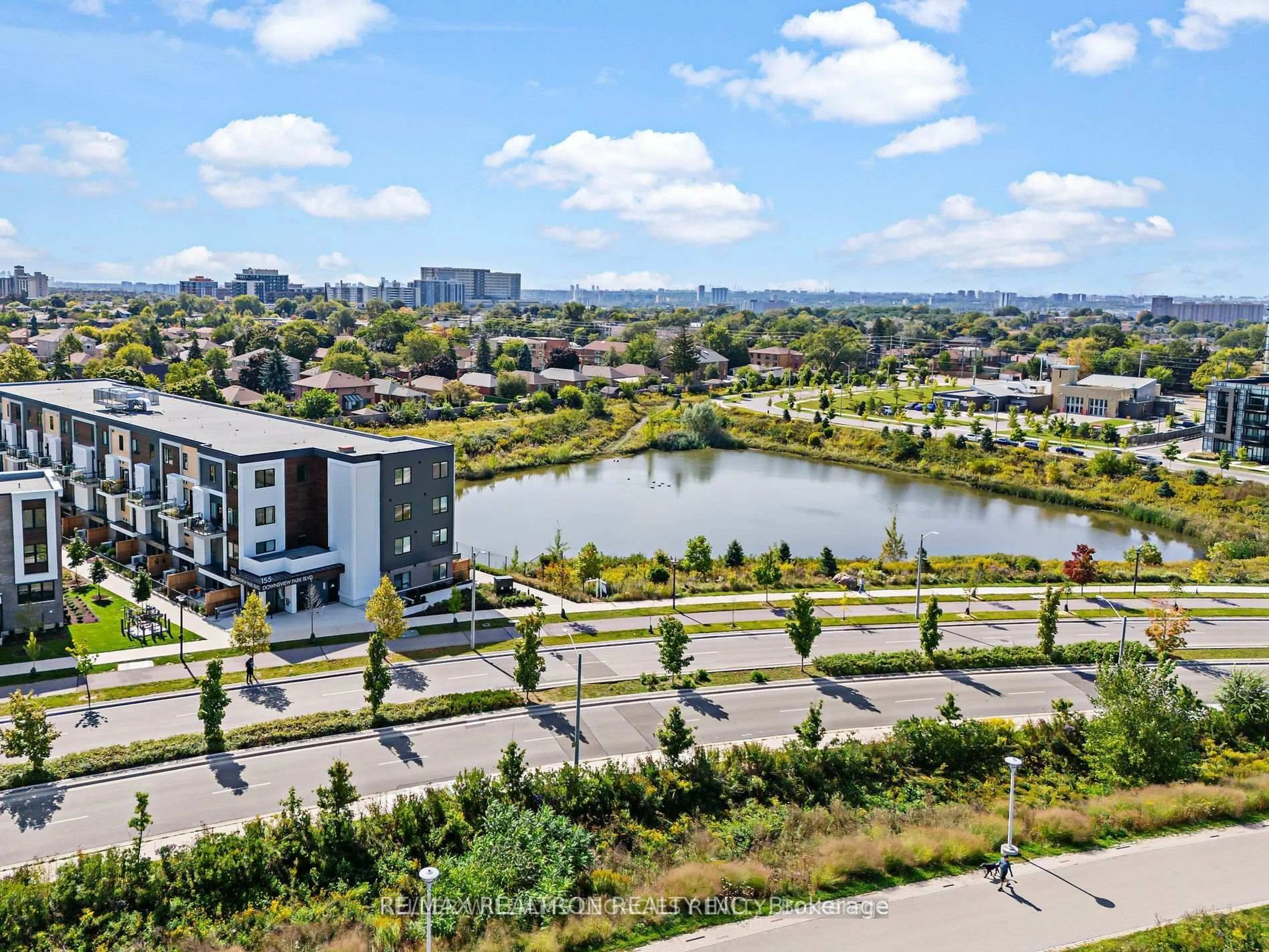 A pic from outside/outdoor area/front of a property/back of a property/a pic from drone, water/lake/river/ocean view for 155 Downsview Park Blvd #206, Toronto Ontario M3K 0E3