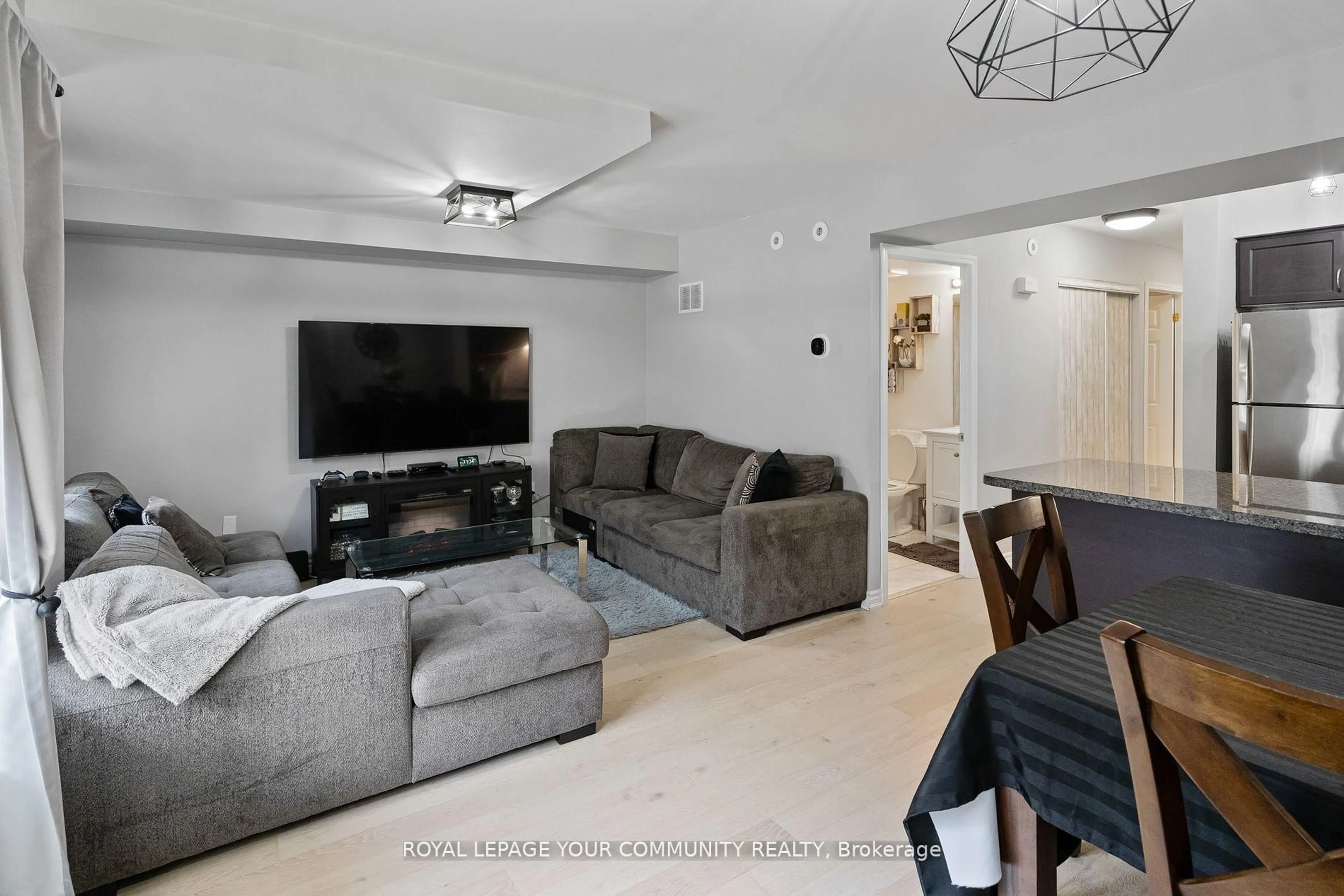 Living room with furniture, unknown for 55 George Appleton Way #1035, Toronto Ontario M3M 0A2