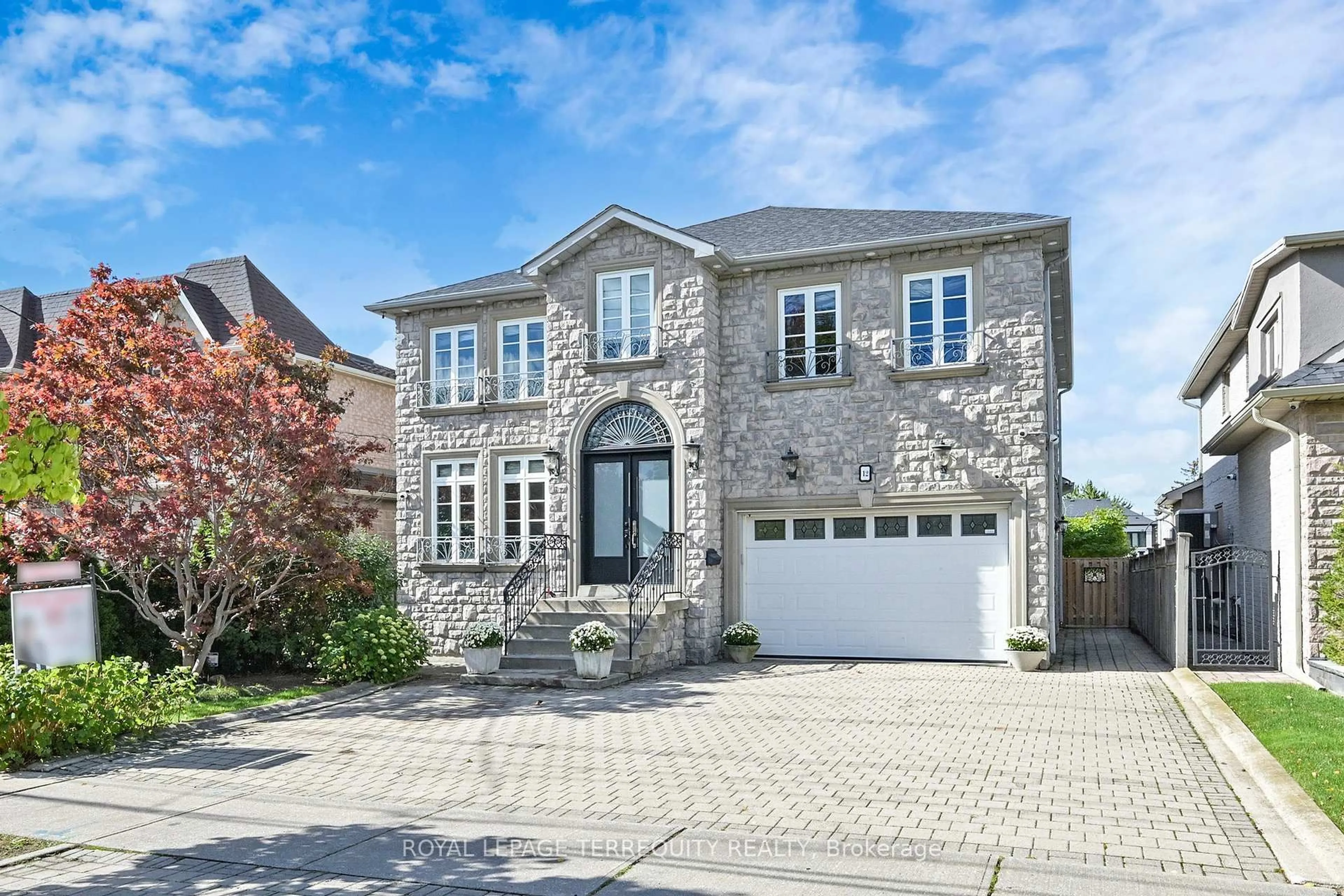 Home with brick exterior material, street for 12 Highland Hill, Toronto Ontario M6A 2P8