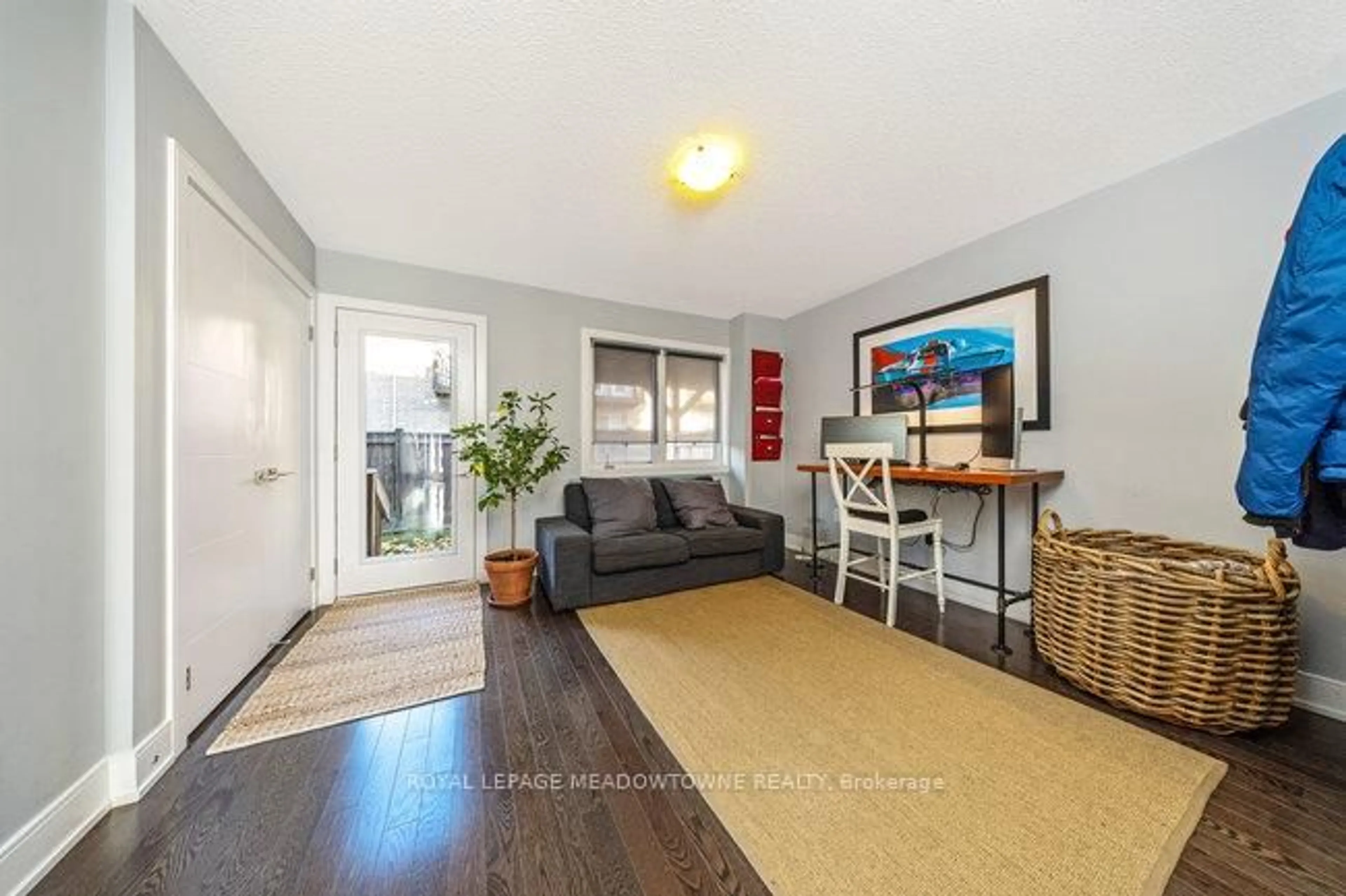 Living room with furniture, wood/laminate floor for 16 Kersey Lane, Halton Hills Ontario L7G 0K1