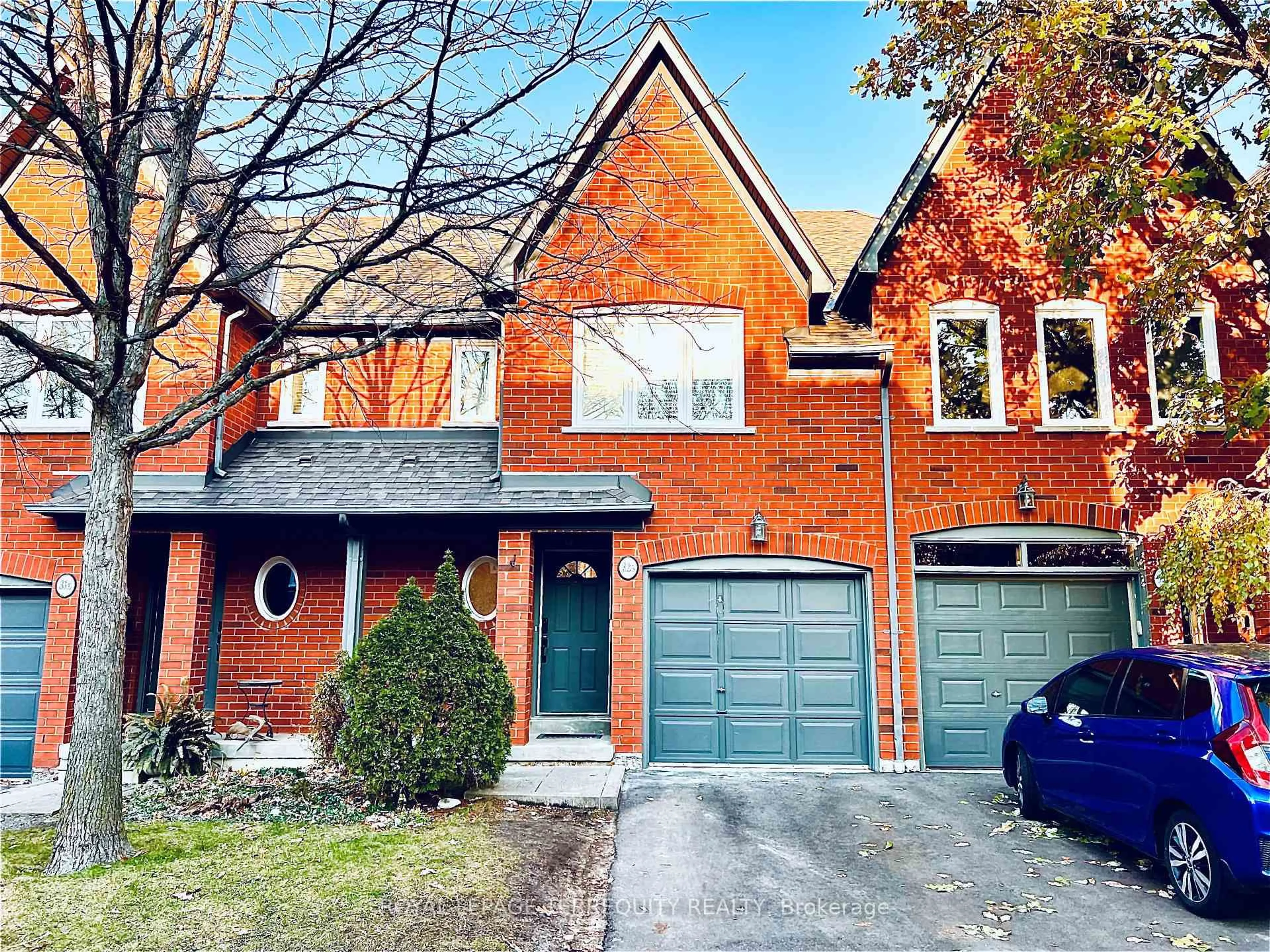 Home with brick exterior material, street for 1084 Queen St #32B, Mississauga Ontario L5H 4K4