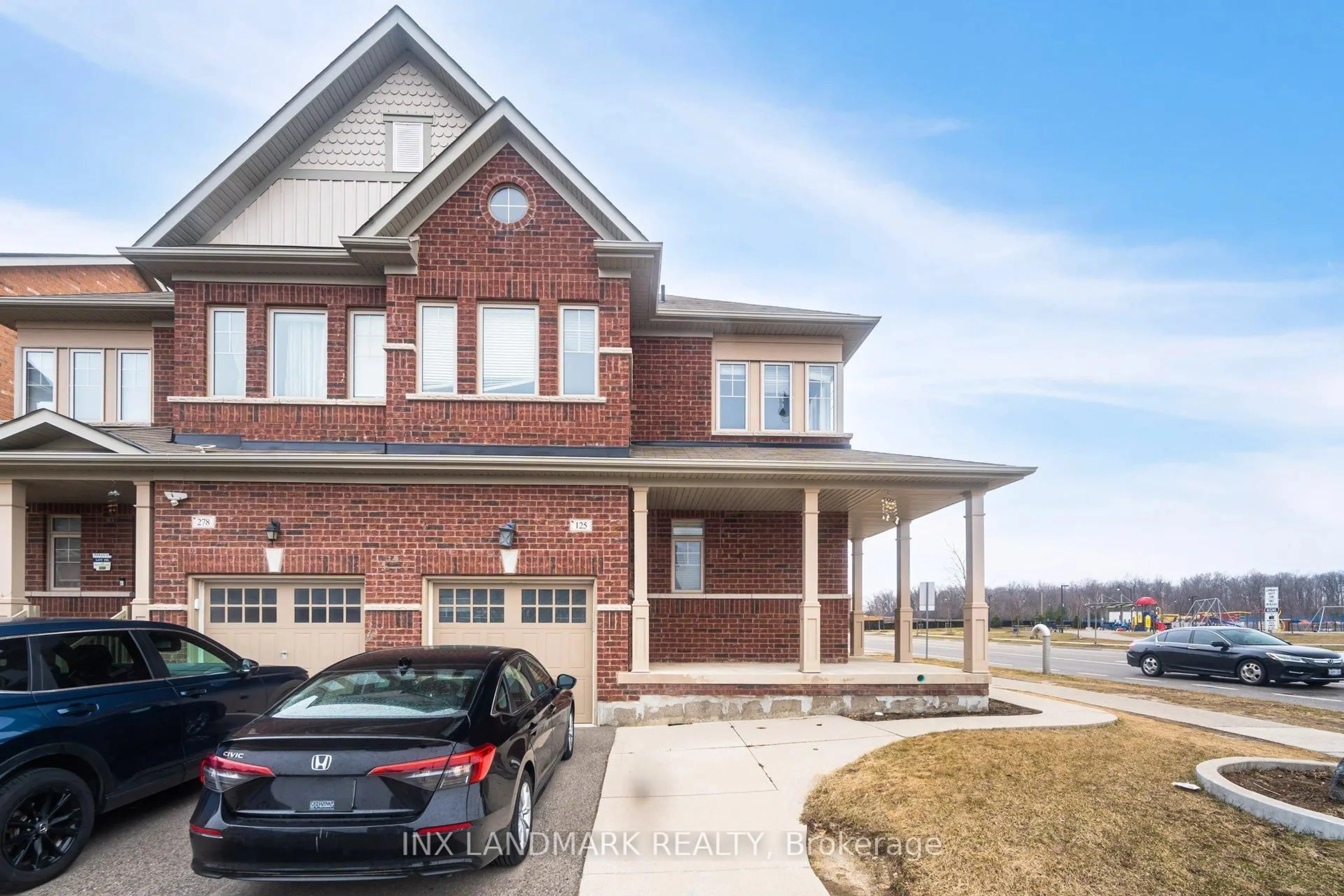 Home with brick exterior material, street for 125 Remembrance Rd, Brampton Ontario L7A 0A8