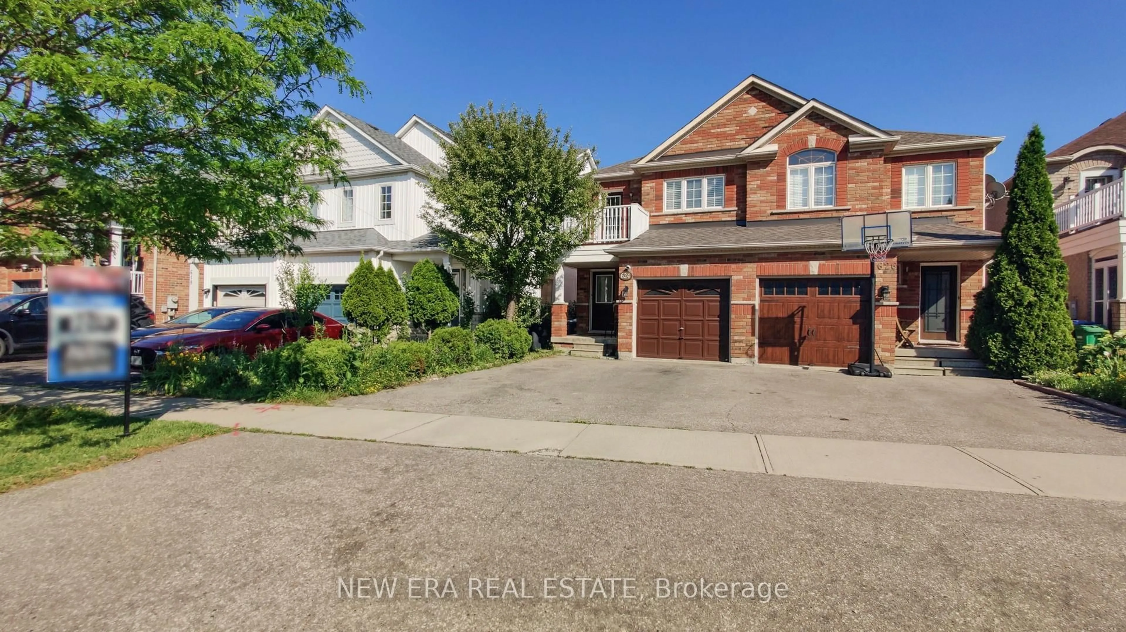 Home with brick exterior material, street for 624 Rossellini Dr, Mississauga Ontario L5W 1M3