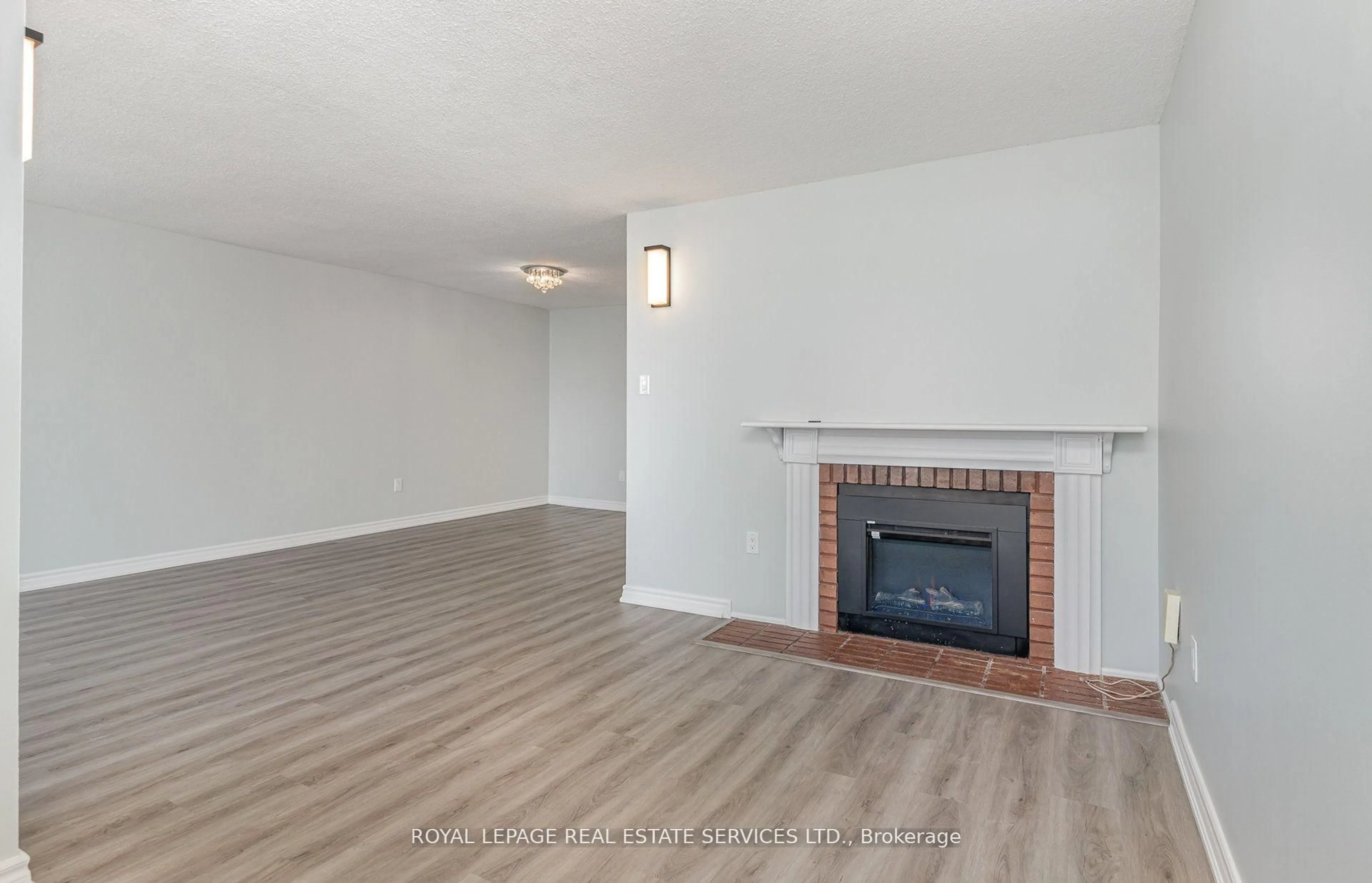 Living room with furniture, wood/laminate floor for 3100 Kirwin Ave #2905, Mississauga Ontario L5A 3S6