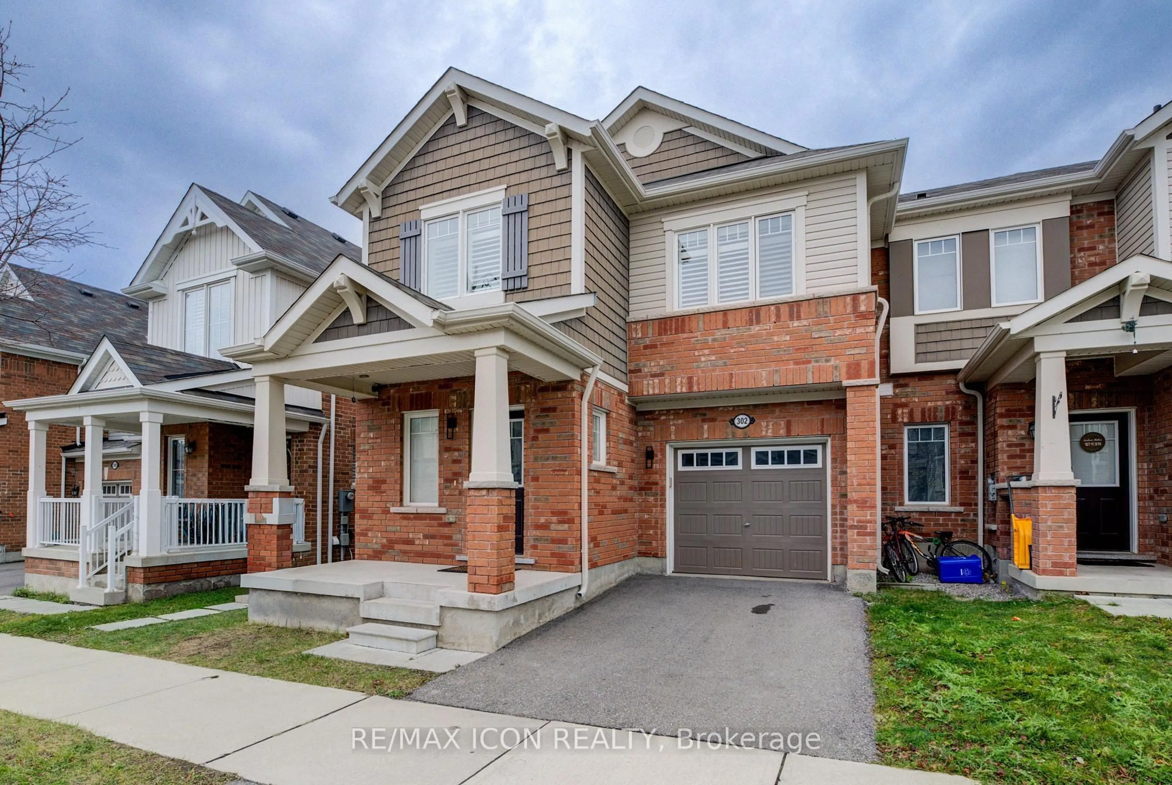 Home with brick exterior material, street for 302 Jean Landing, Milton Ontario L9E 1C6