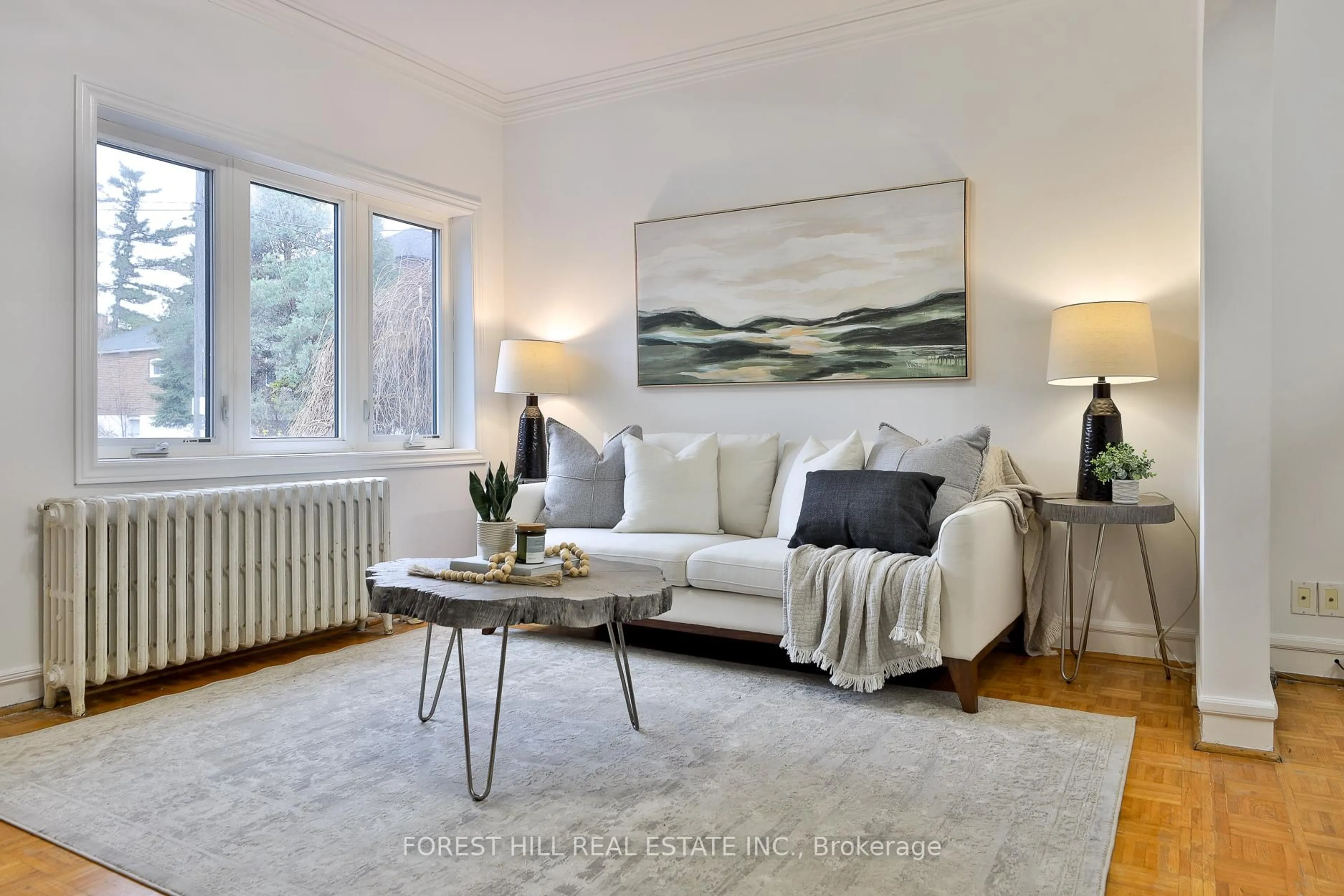 Living room with furniture, wood/laminate floor for 912 Briar Hill Ave, Toronto Ontario M6B 1M2