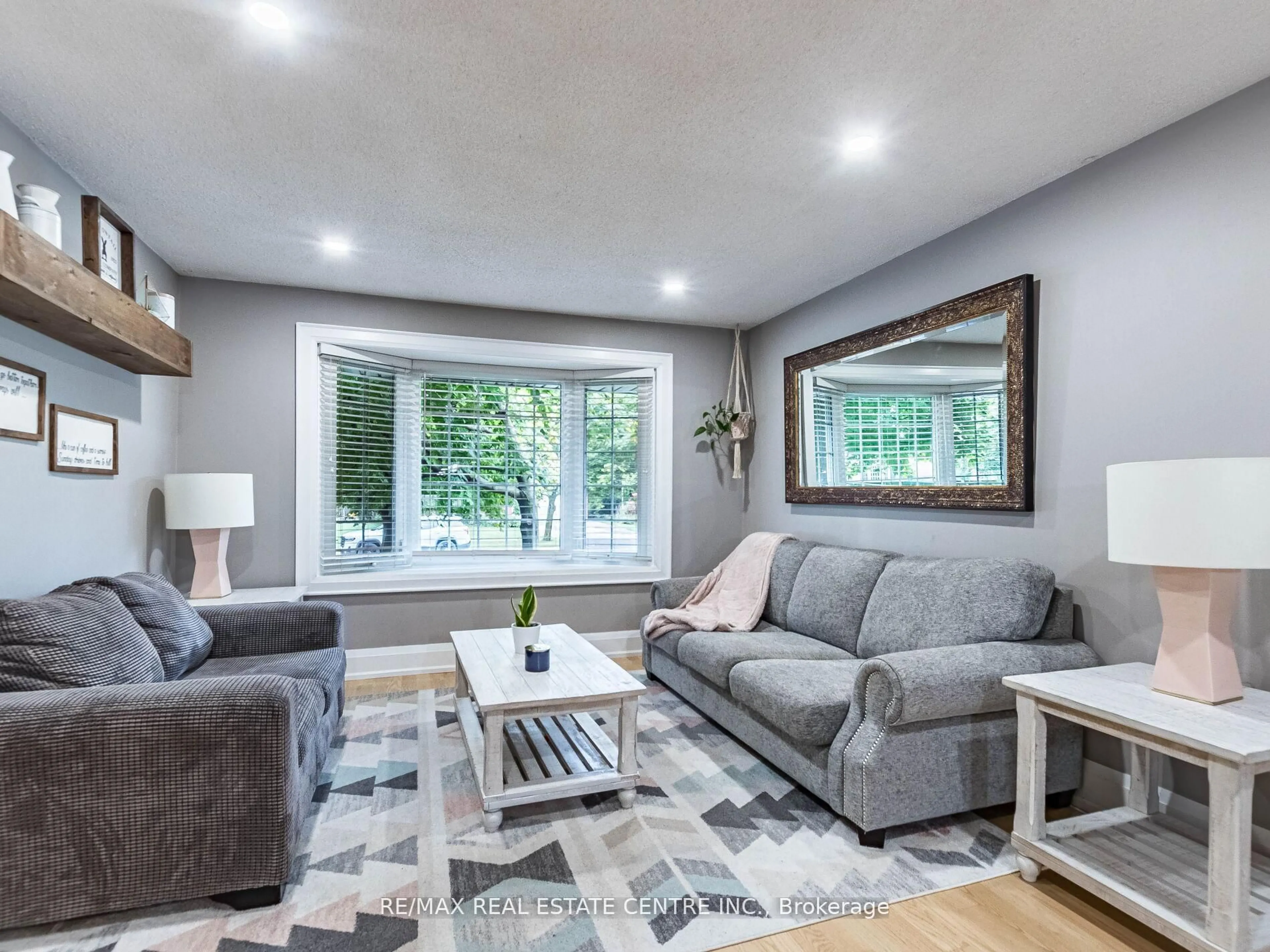 Living room with furniture, wood/laminate floor for 678 Harrison Rd, Milton Ontario L9T 4S9