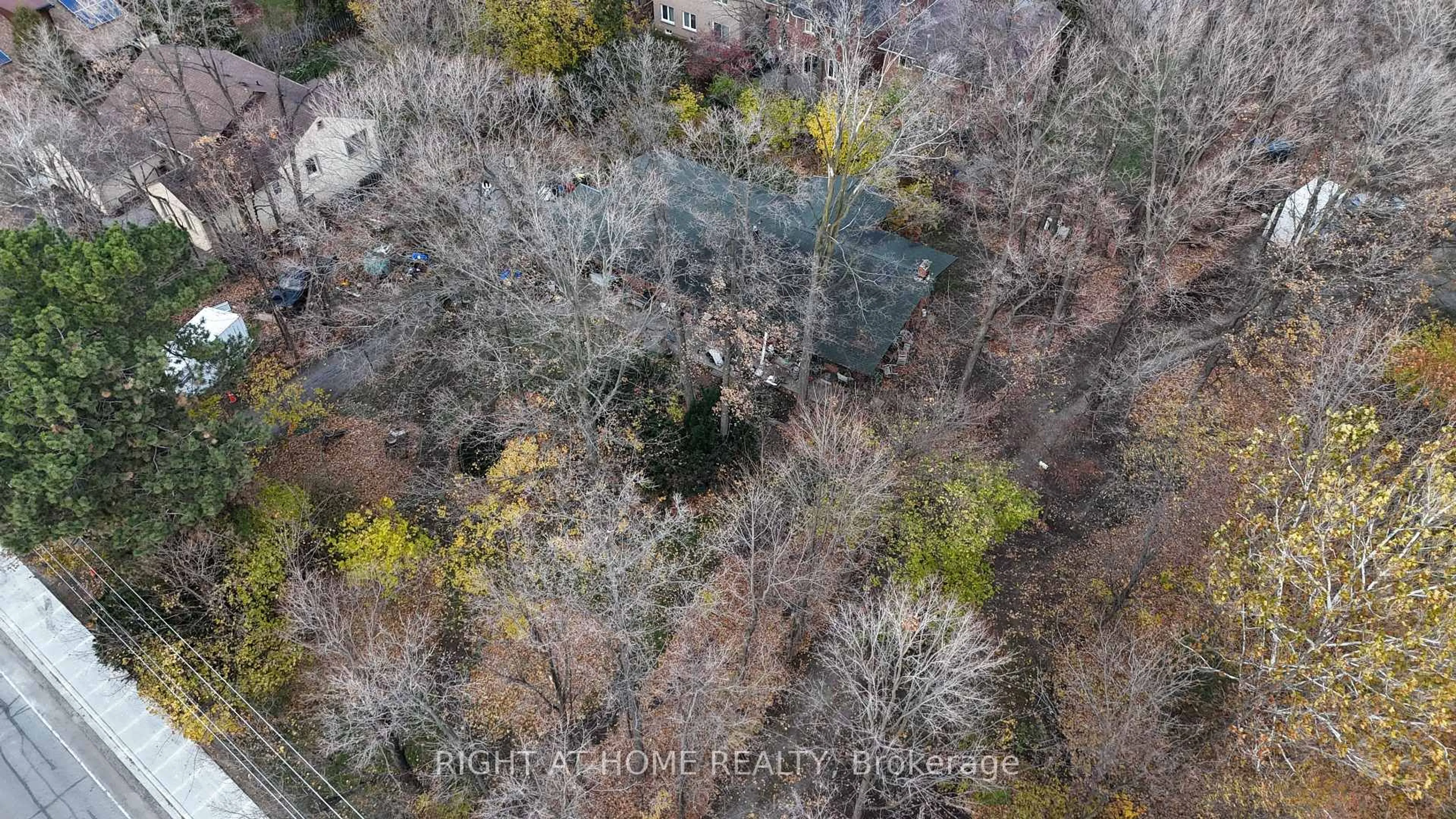 A pic from outside/outdoor area/front of a property/back of a property/a pic from drone, forest/trees view for 2471 Fifth Line, Mississauga Ontario L5K 1V9