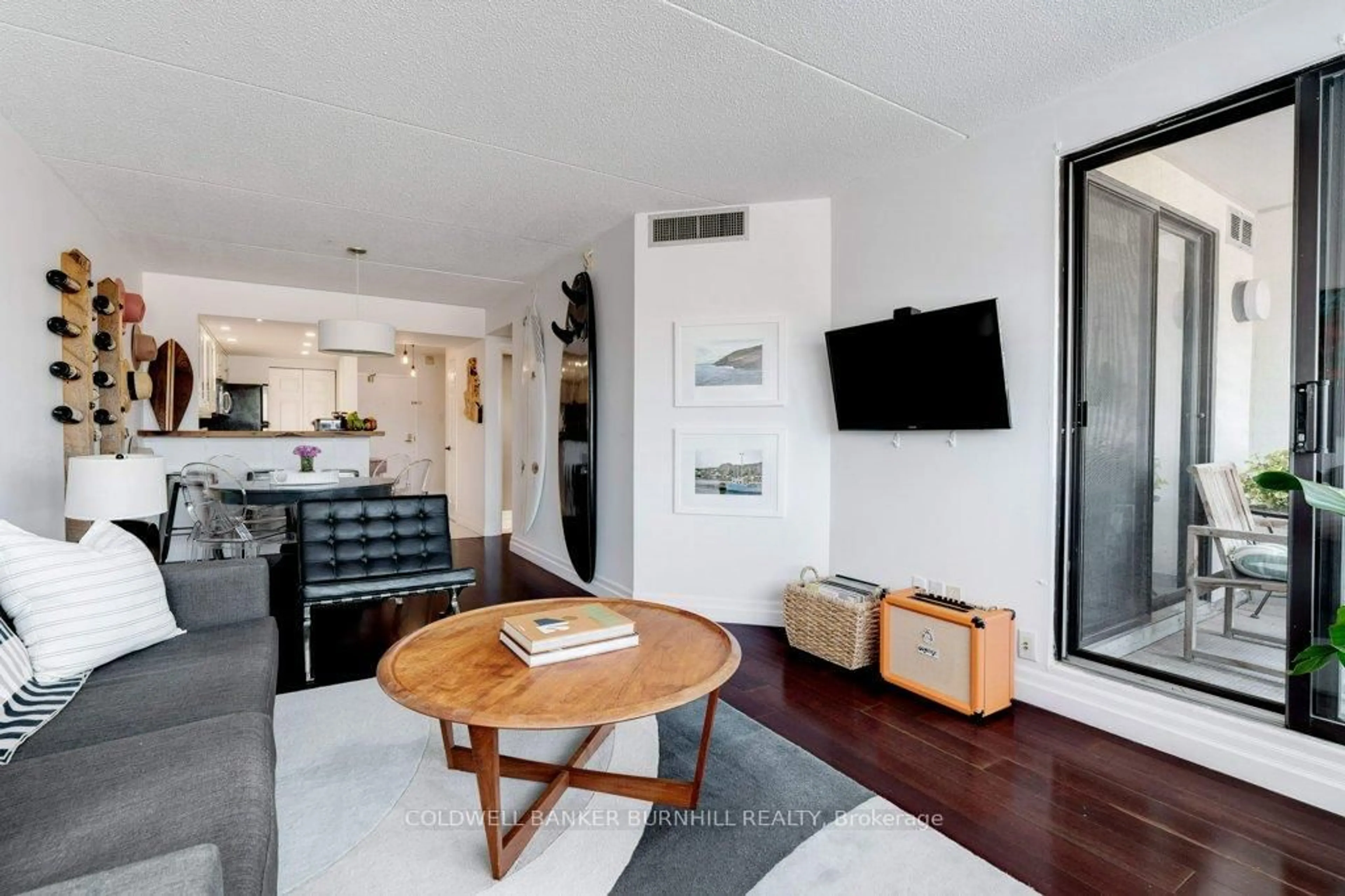 Living room with furniture, wood/laminate floor for 100 Bronte Rd #214, Oakville Ontario L6L 6L5