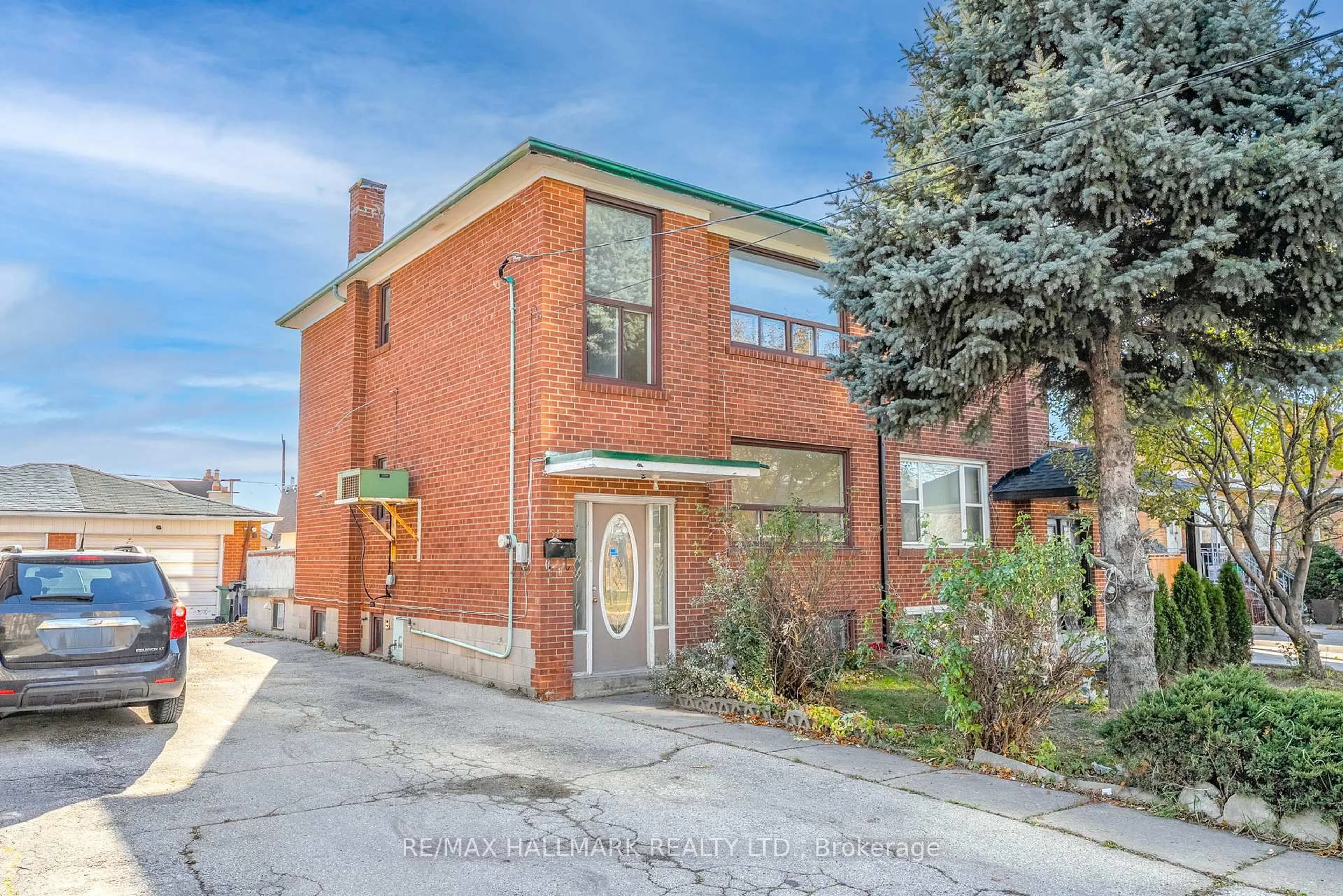 Home with brick exterior material, street for 25 Falstaff Ave, Toronto Ontario M6L 2C6