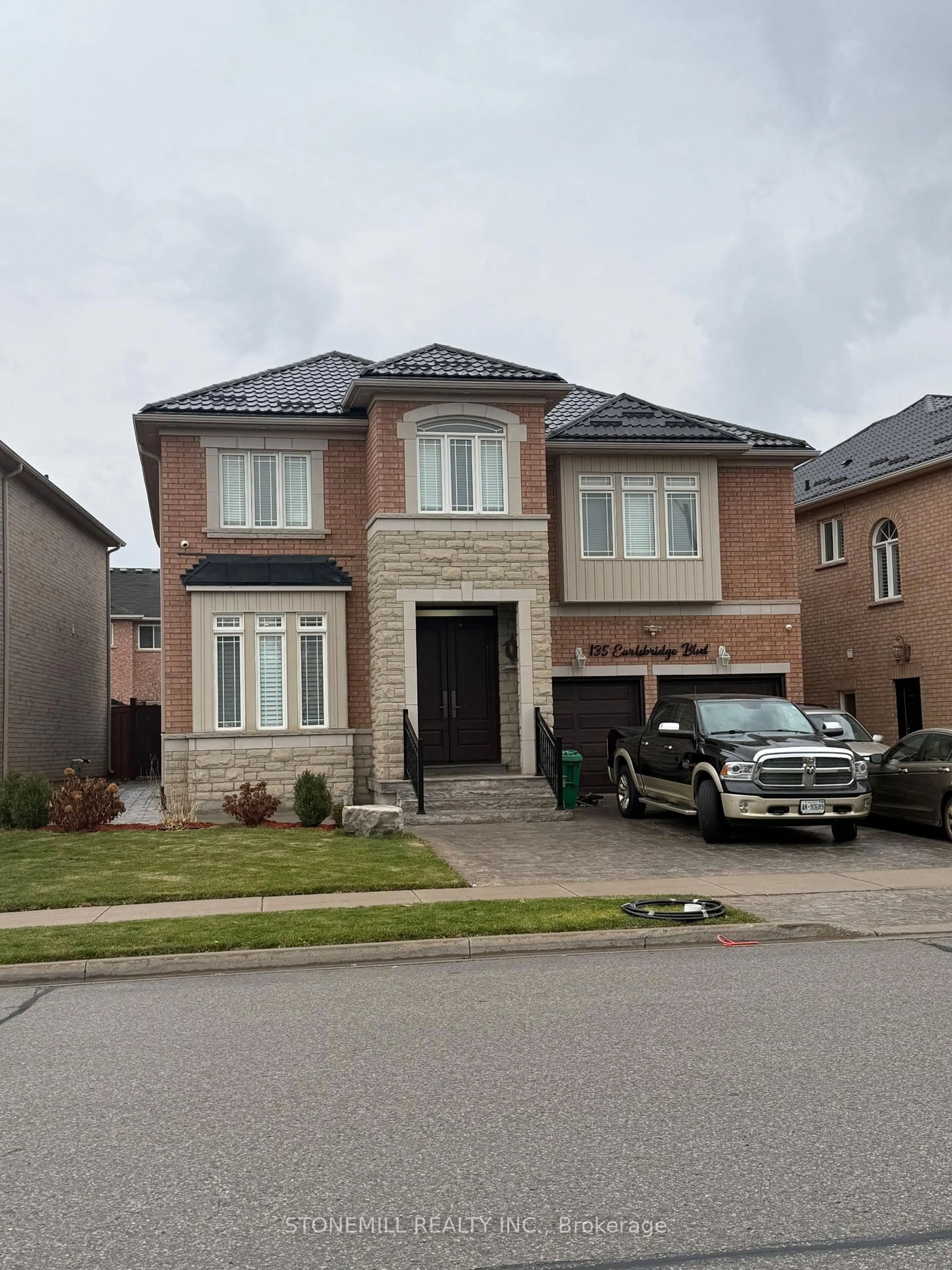 Home with brick exterior material, street for 135 Earlsbridge Blvd, Brampton Ontario L7A 3T7
