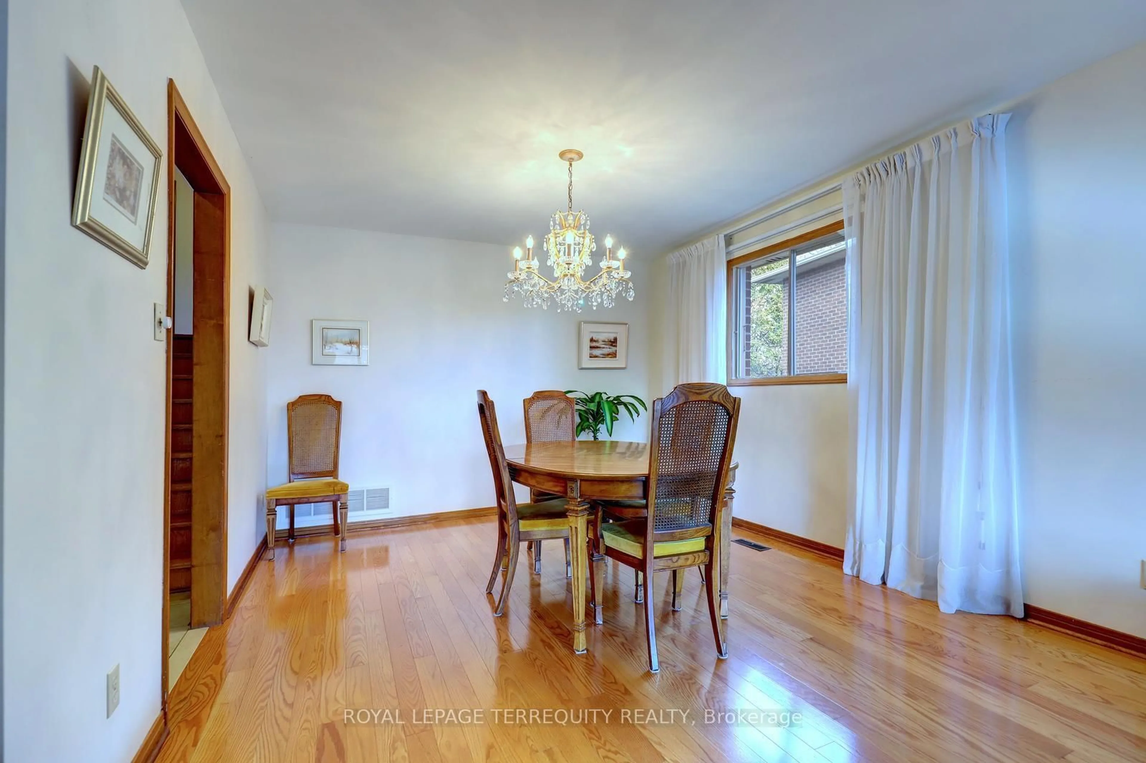 Dining room, wood/laminate floor for 7 Princeton Terr, Brampton Ontario L6S 3S4