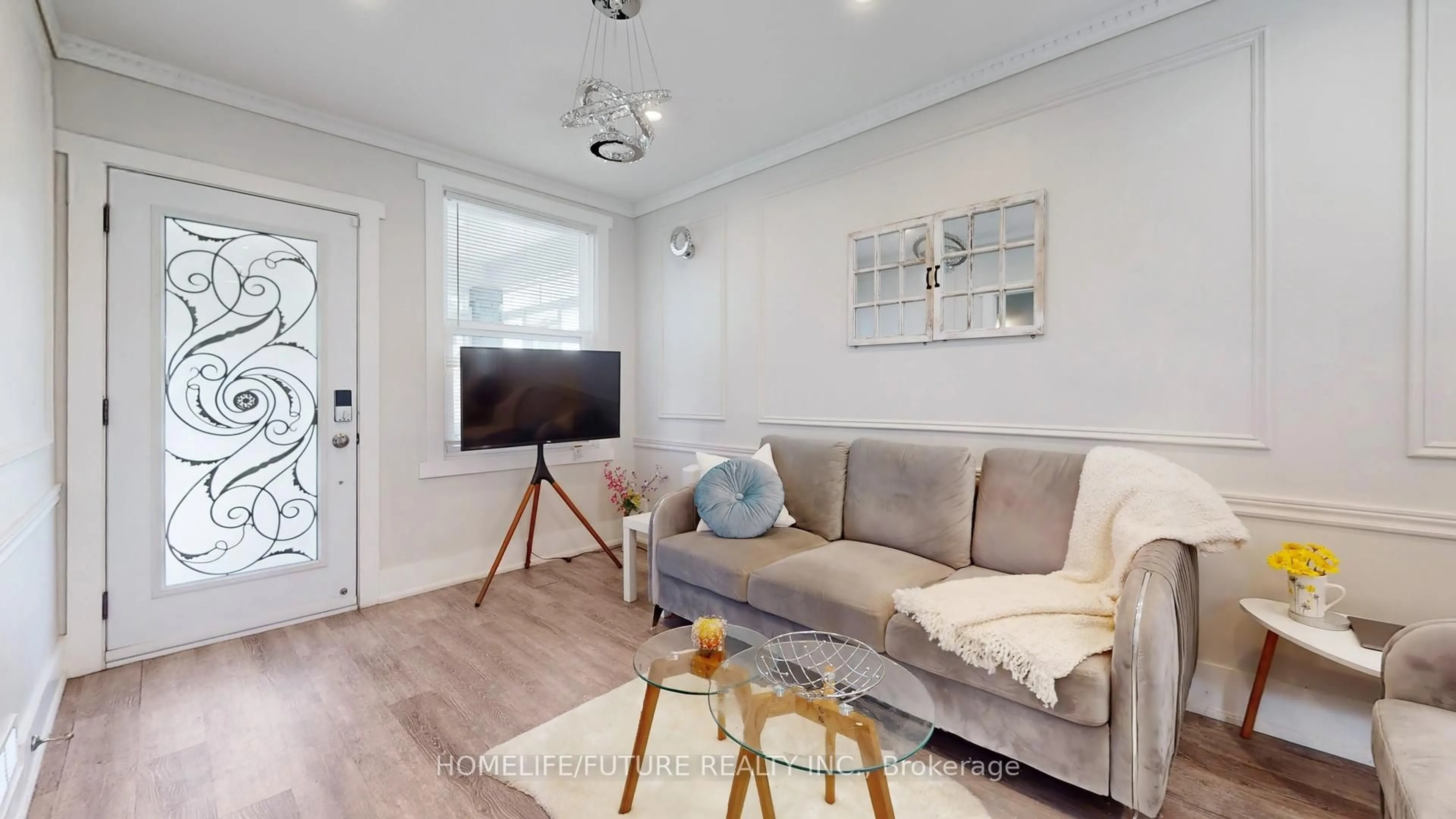 Living room with furniture, wood/laminate floor for 82 Heman St, Toronto Ontario M8V 1X5