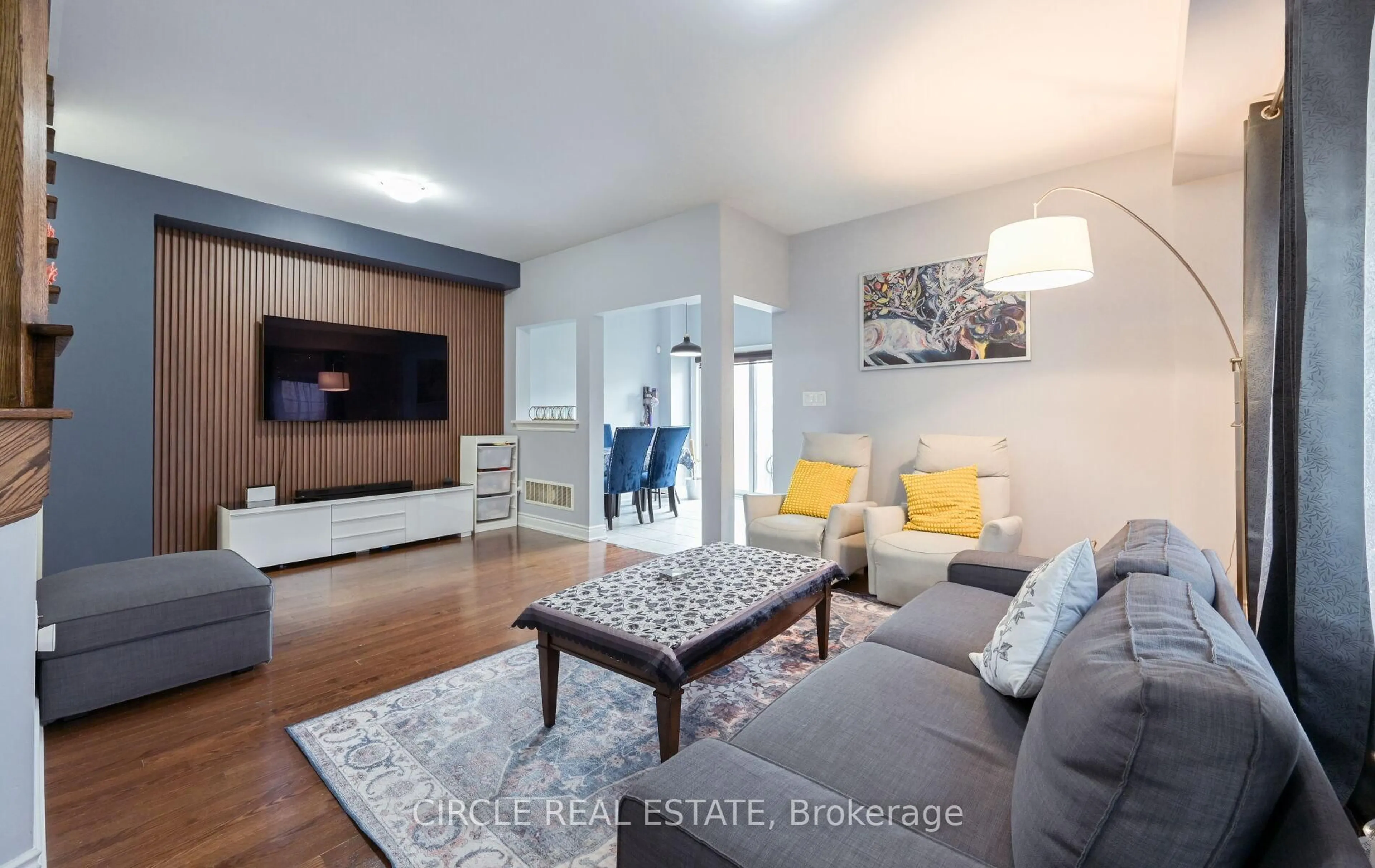 Living room with furniture, wood/laminate floor for 22 Brussels Ave, Brampton Ontario L6Z 0A5
