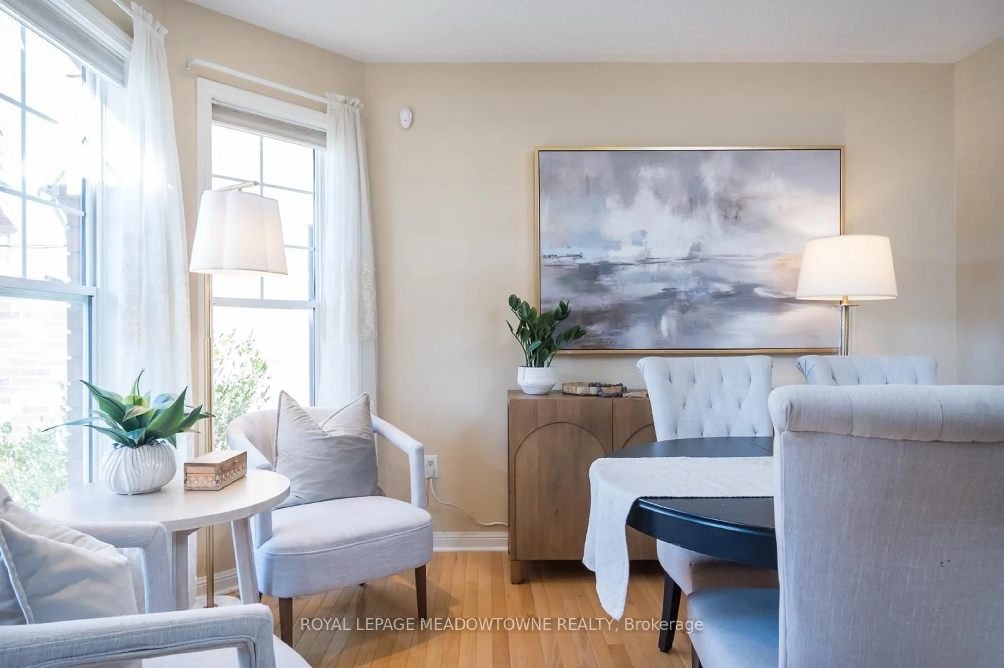 Living room with furniture, wood/laminate floor for 701 Thompson Rd, Milton Ontario L9T 5W8