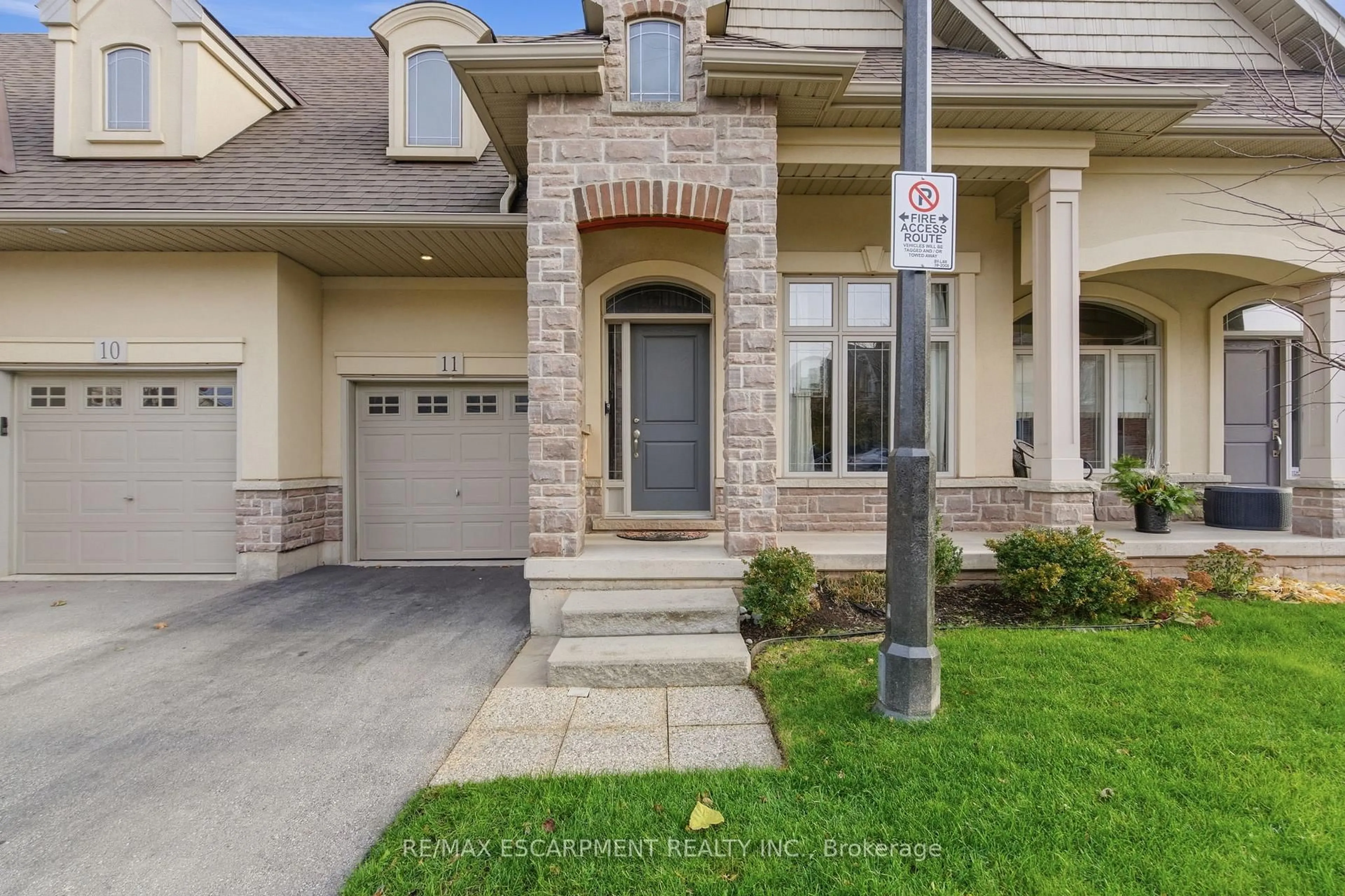 Home with brick exterior material, street for 5056 New St #11, Burlington Ontario L7L 0H4