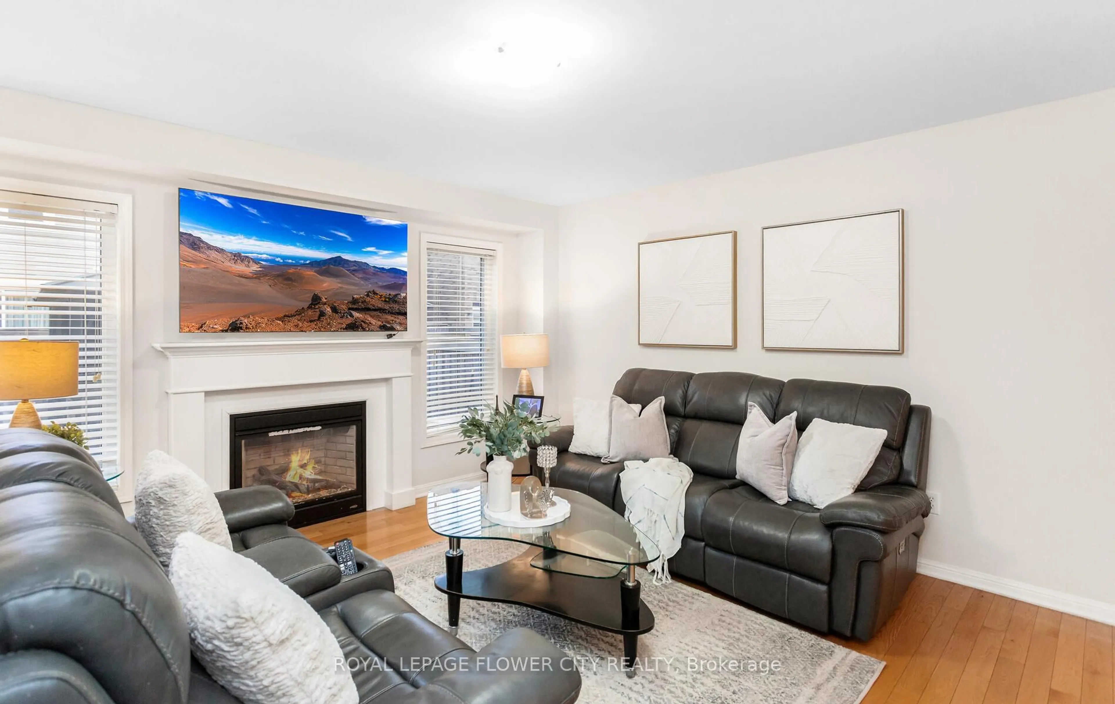 Living room with furniture, wood/laminate floor for 47 Haverty Tr, Brampton Ontario L7A 0S3