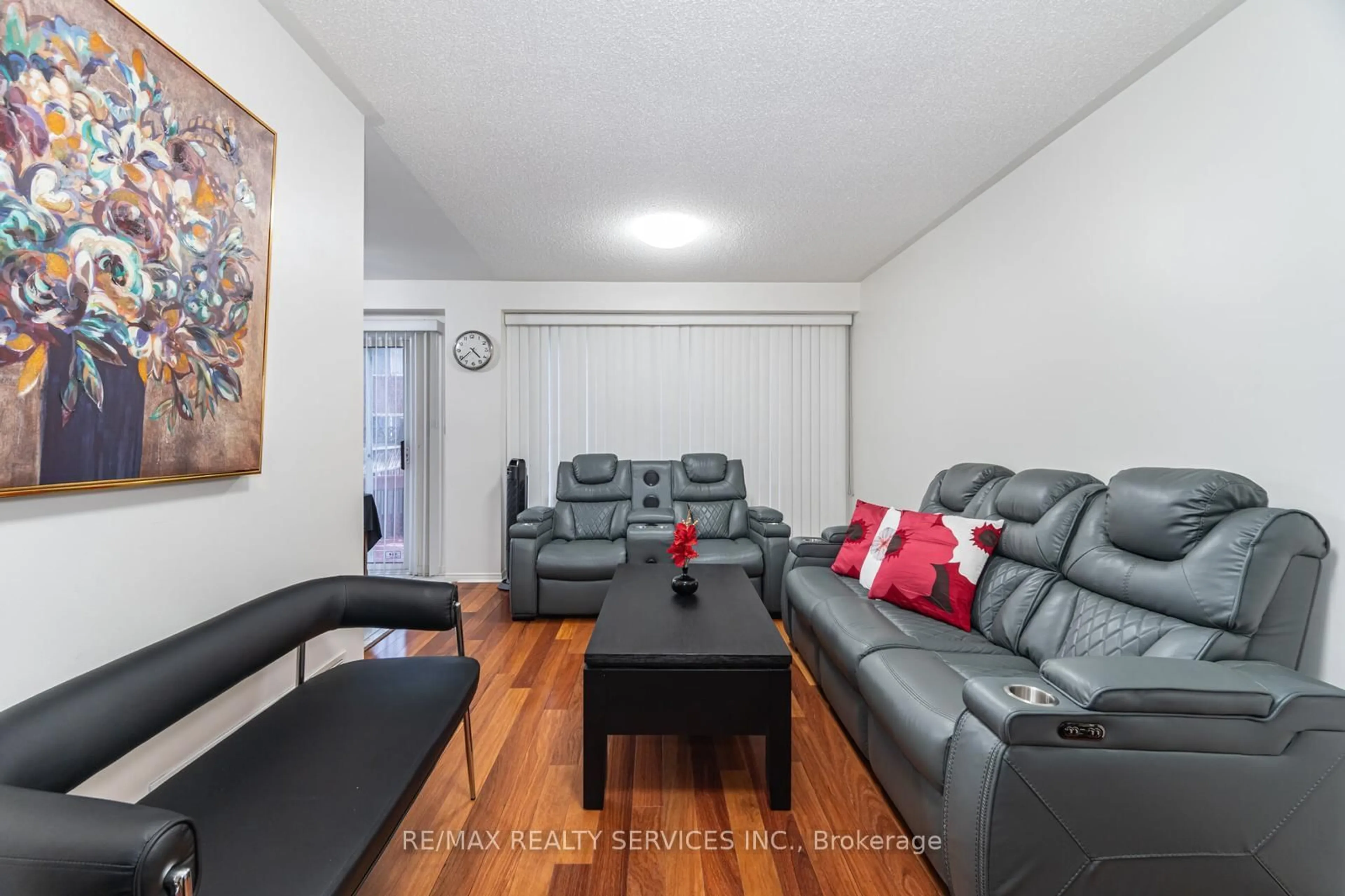 Living room with furniture, wood/laminate floor for 9 kimberley Cres, Brampton Ontario L6R 1T6