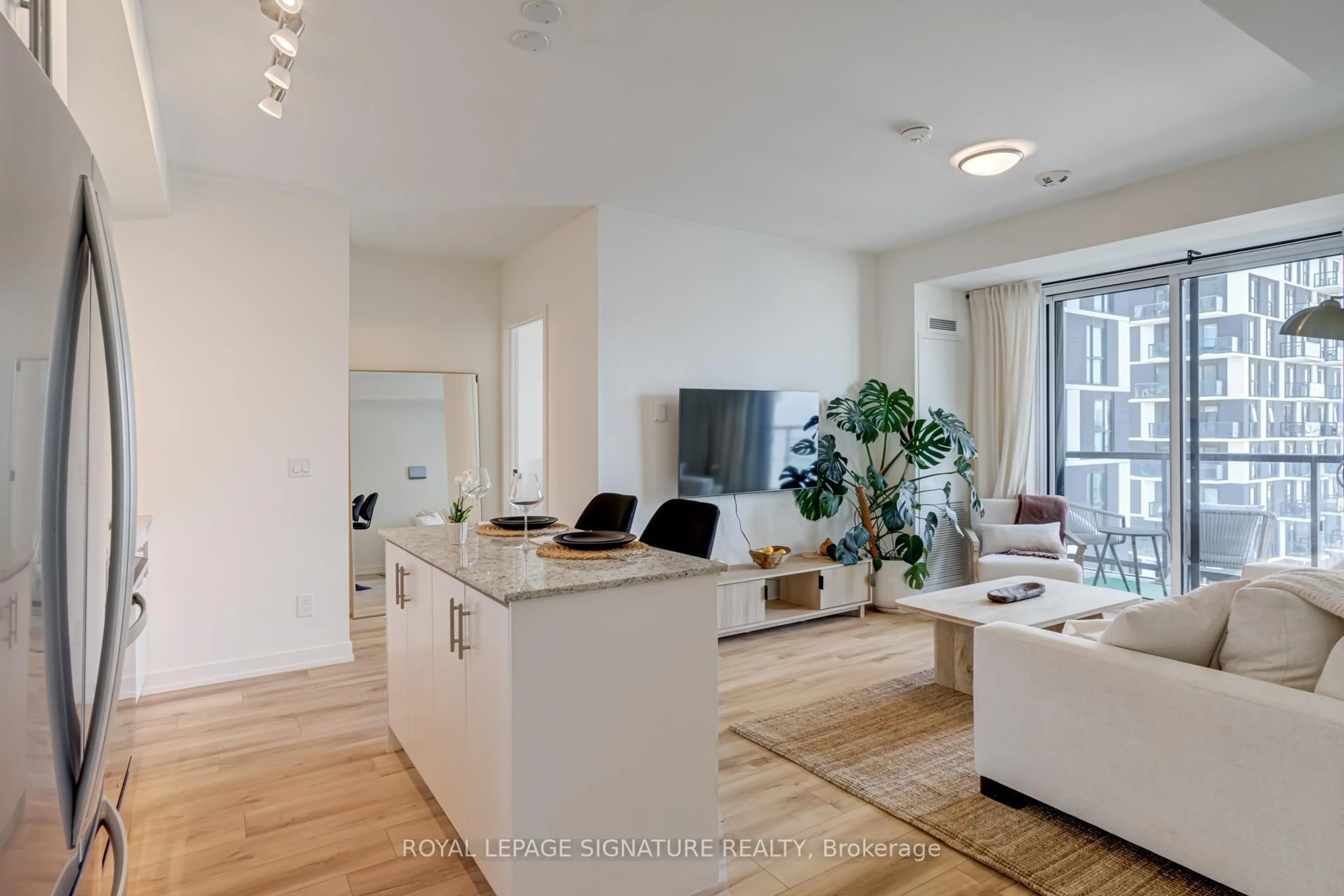 Living room with furniture, unknown for 335 Wheat Boom Dr #503, Oakville Ontario L6H 7Y1