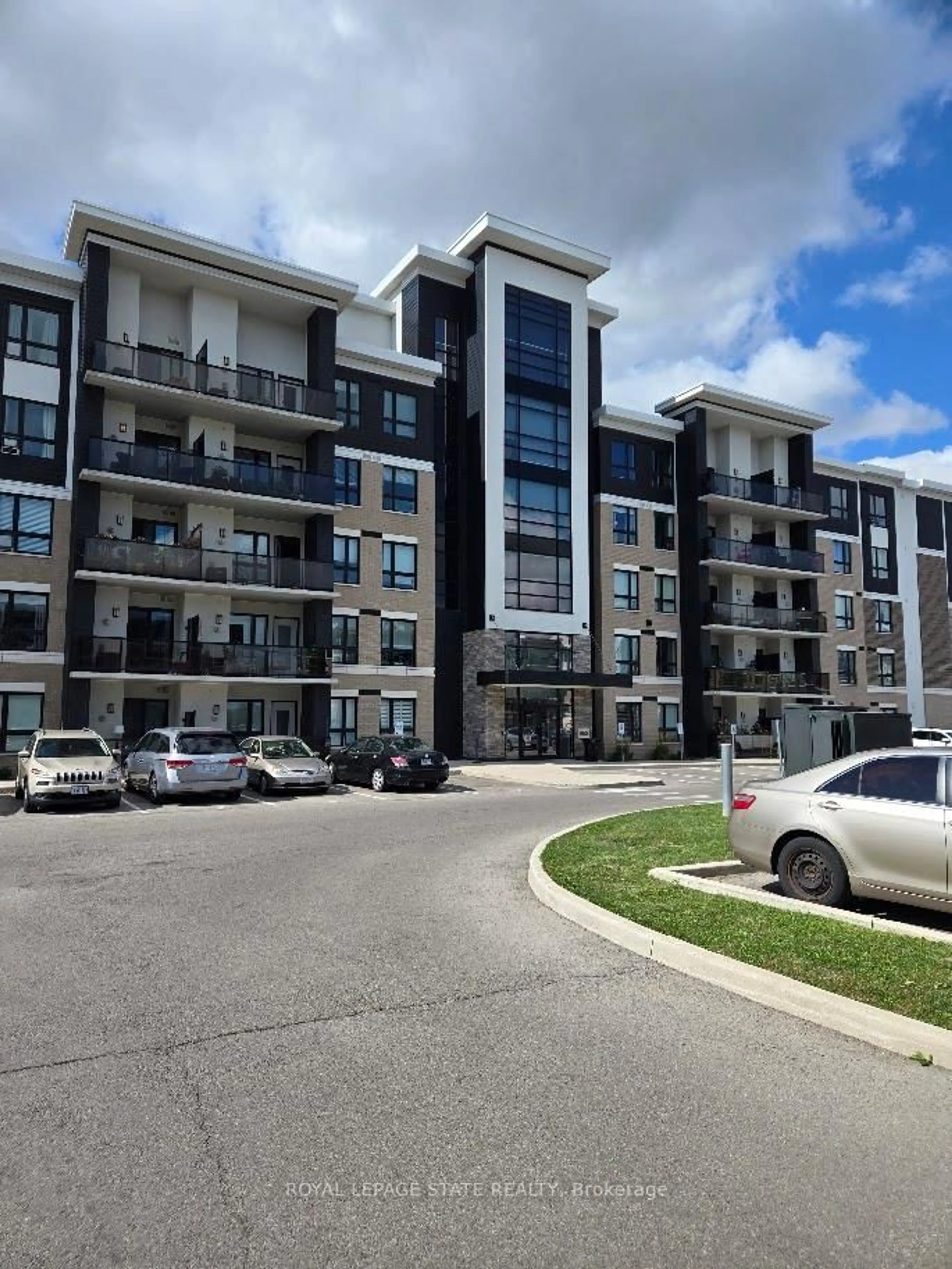 A pic from outside/outdoor area/front of a property/back of a property/a pic from drone, unknown for 650 Sauve St #404, Milton Ontario L9T 9A8