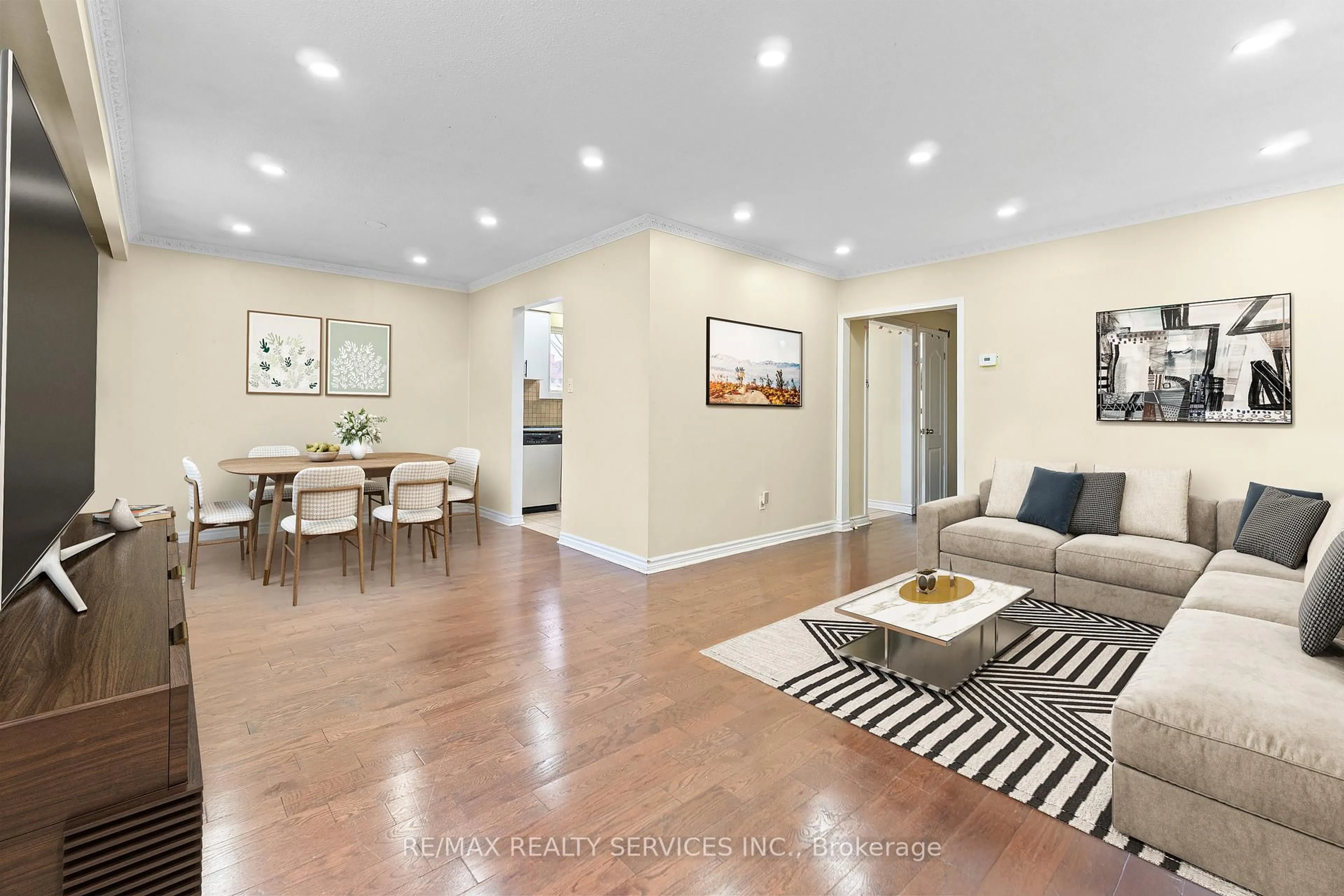 Living room with furniture, wood/laminate floor for 13 Linkdale Rd, Brampton Ontario L6V 3A1