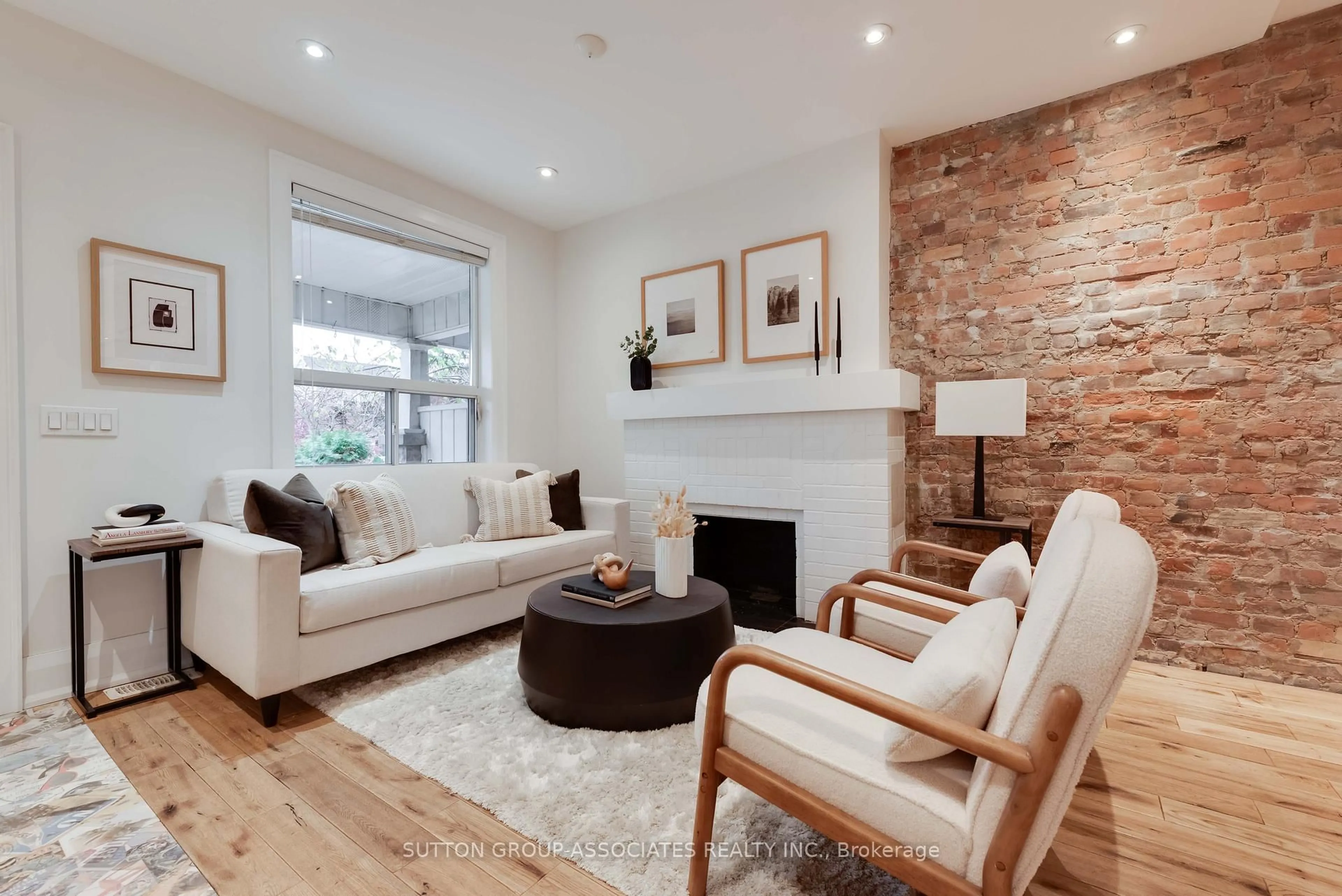 Living room with furniture, wood/laminate floor for 148 Boon Ave, Toronto Ontario M6E 3Z5