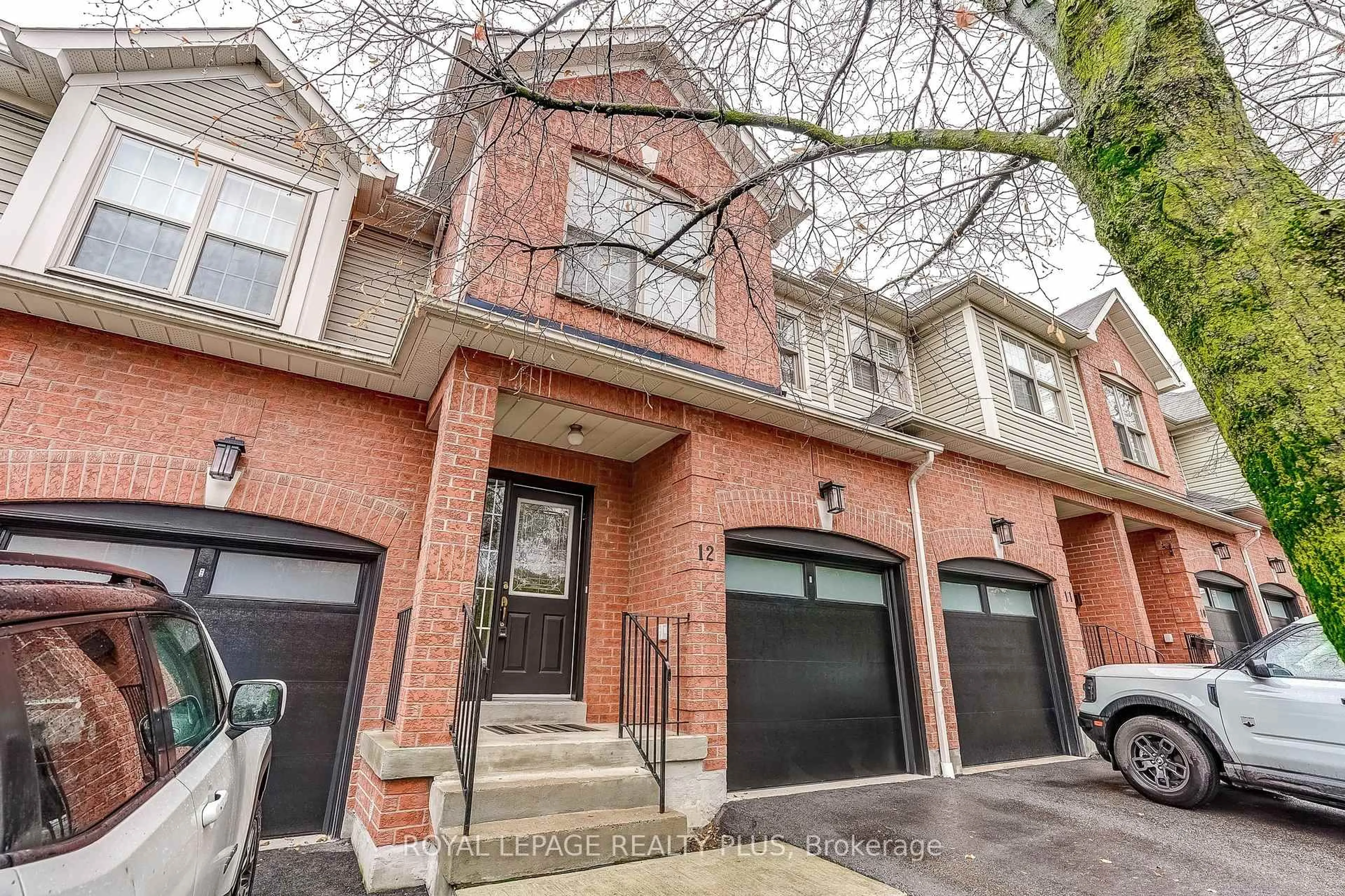Home with brick exterior material, street for 2385 Fifth Line #12, Mississauga Ontario L5K 1V9