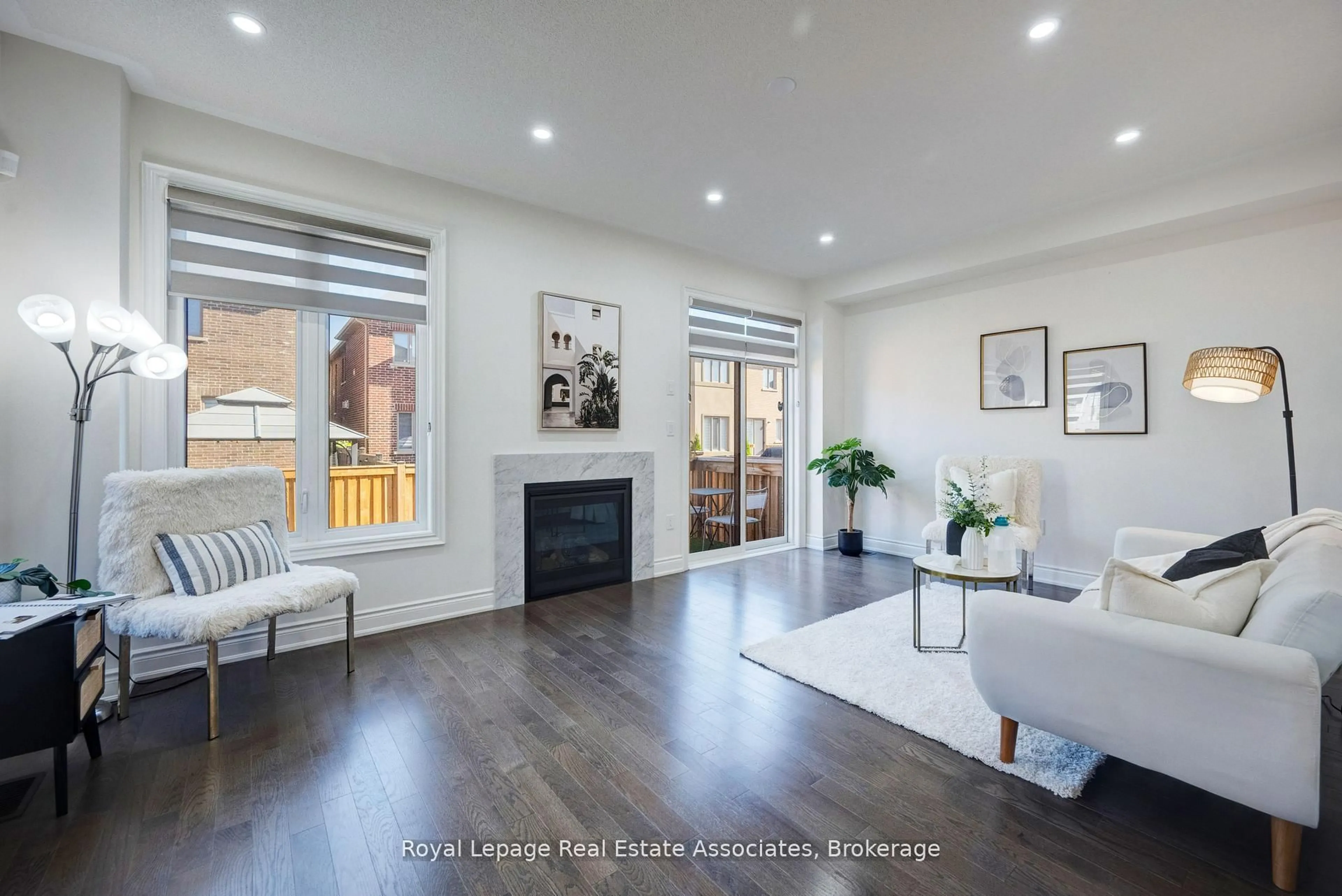 Living room with furniture, wood/laminate floor for 13 Quinton Rdge, Brampton Ontario L6Y 6J4