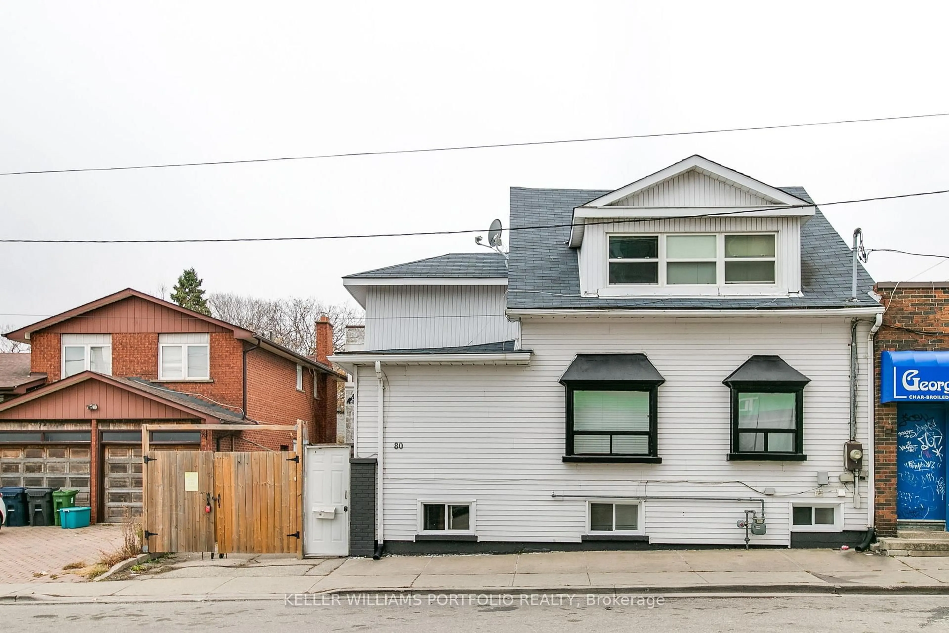 Home with brick exterior material, street for 80 Long Branch Ave, Toronto Ontario M8W 3J4