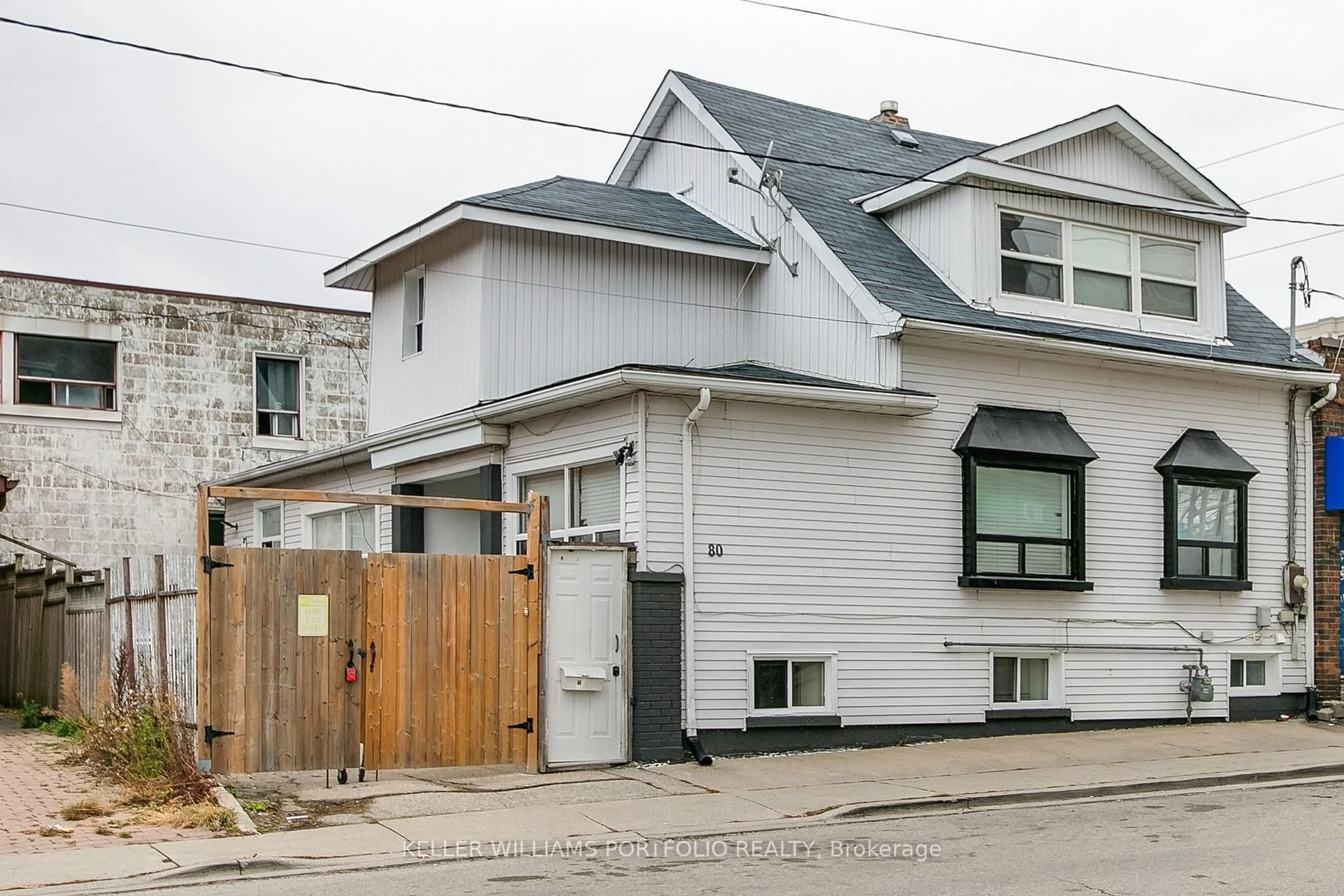 Home with brick exterior material, street for 80 Long Branch Ave, Toronto Ontario M8W 3J4