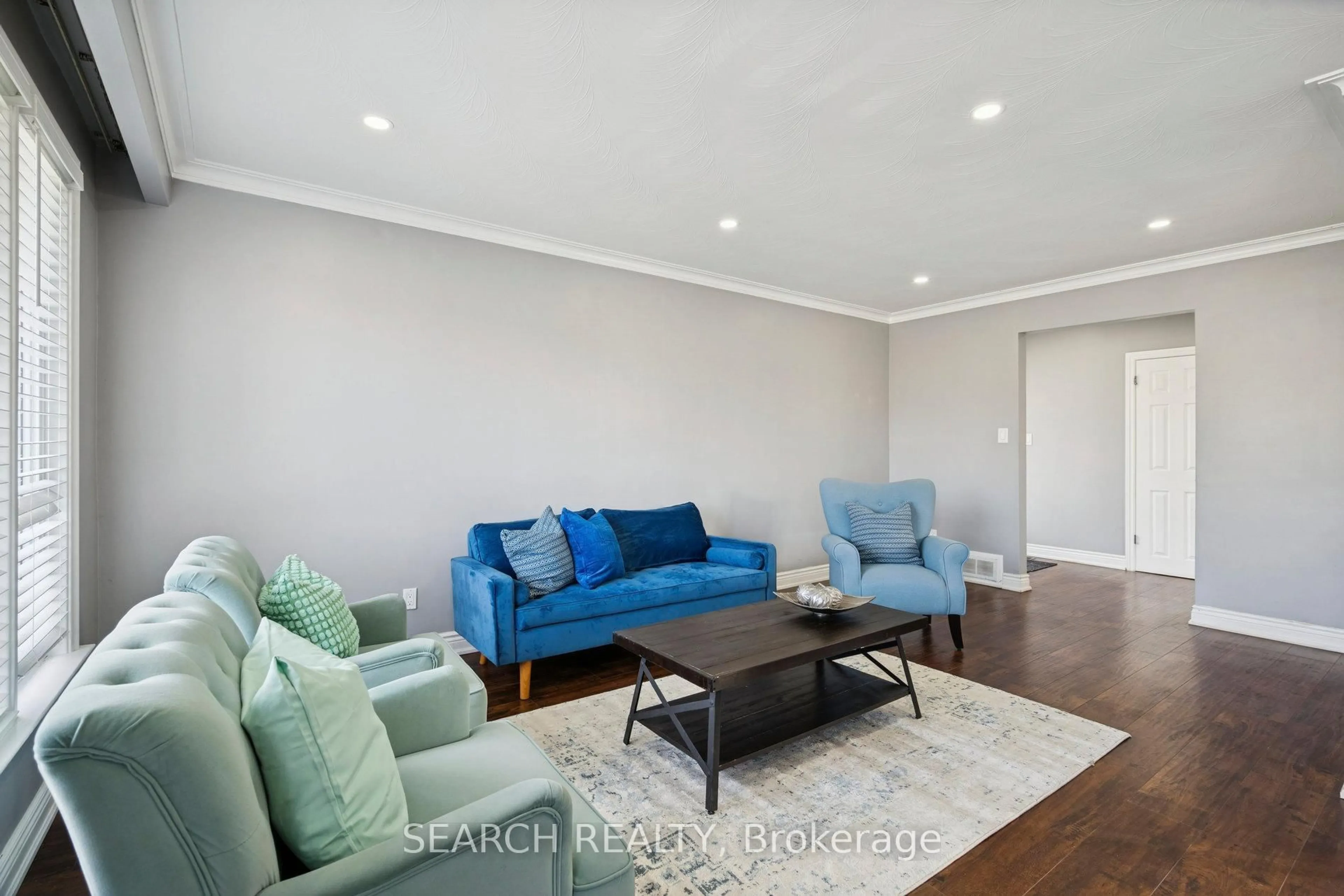 Living room with furniture, wood/laminate floor for 151 The Westway, Toronto Ontario M9P 2B6