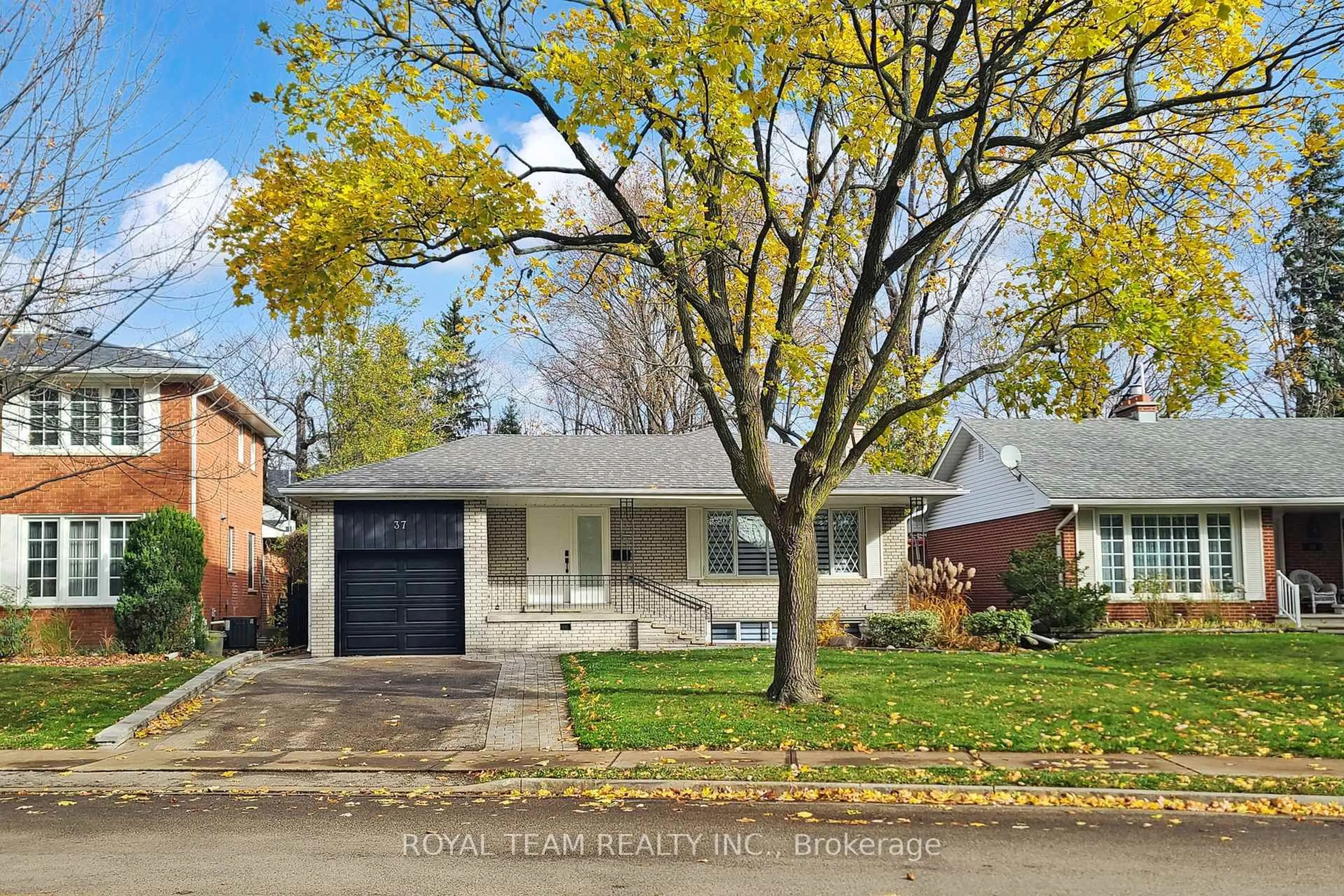 Home with brick exterior material, street for 37 Markland Dr, Toronto Ontario M9C 1M9