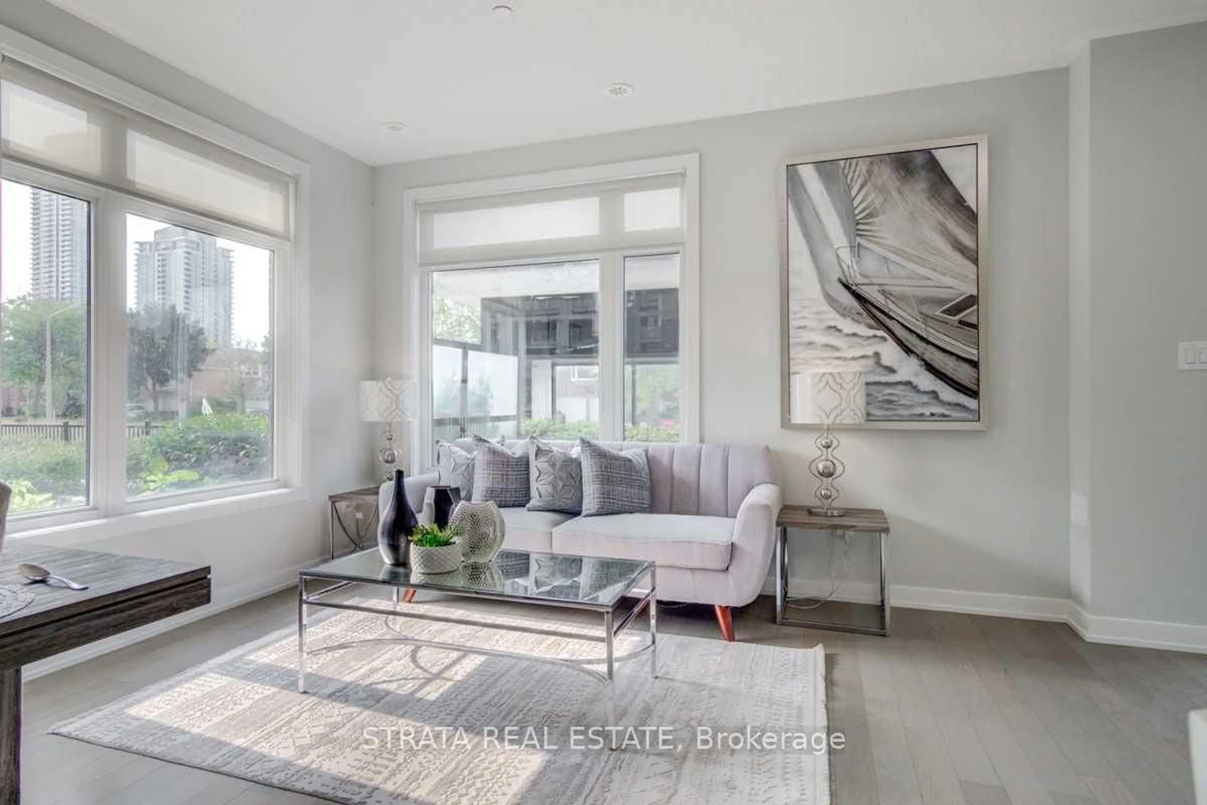 Living room with furniture, unknown for 4070 Parkside Village Dr #Th 12, Mississauga Ontario L5B 0K2