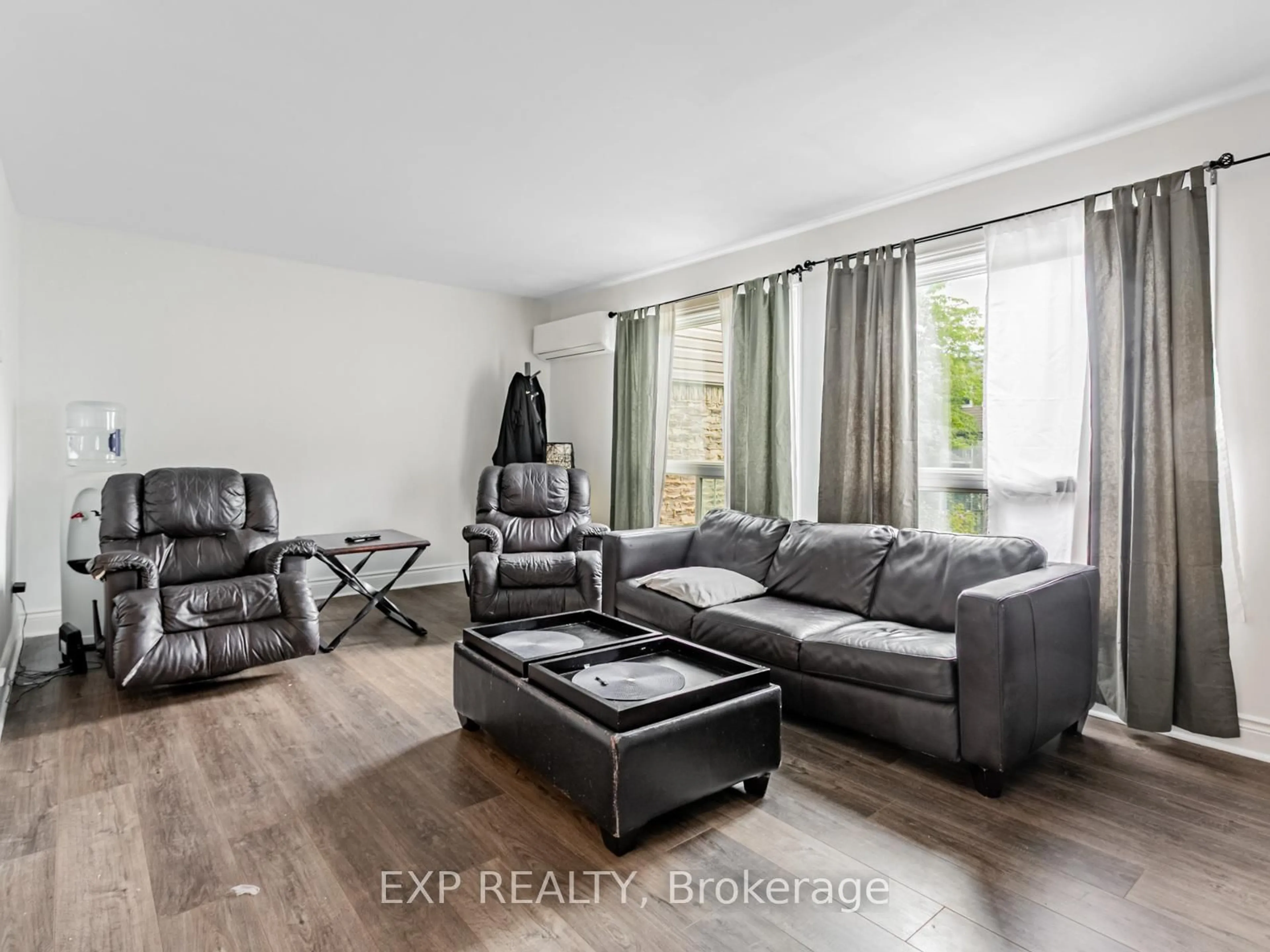 Living room with furniture, wood/laminate floor for 2050 Upper Middle Rd #64, Burlington Ontario L7P 3R9