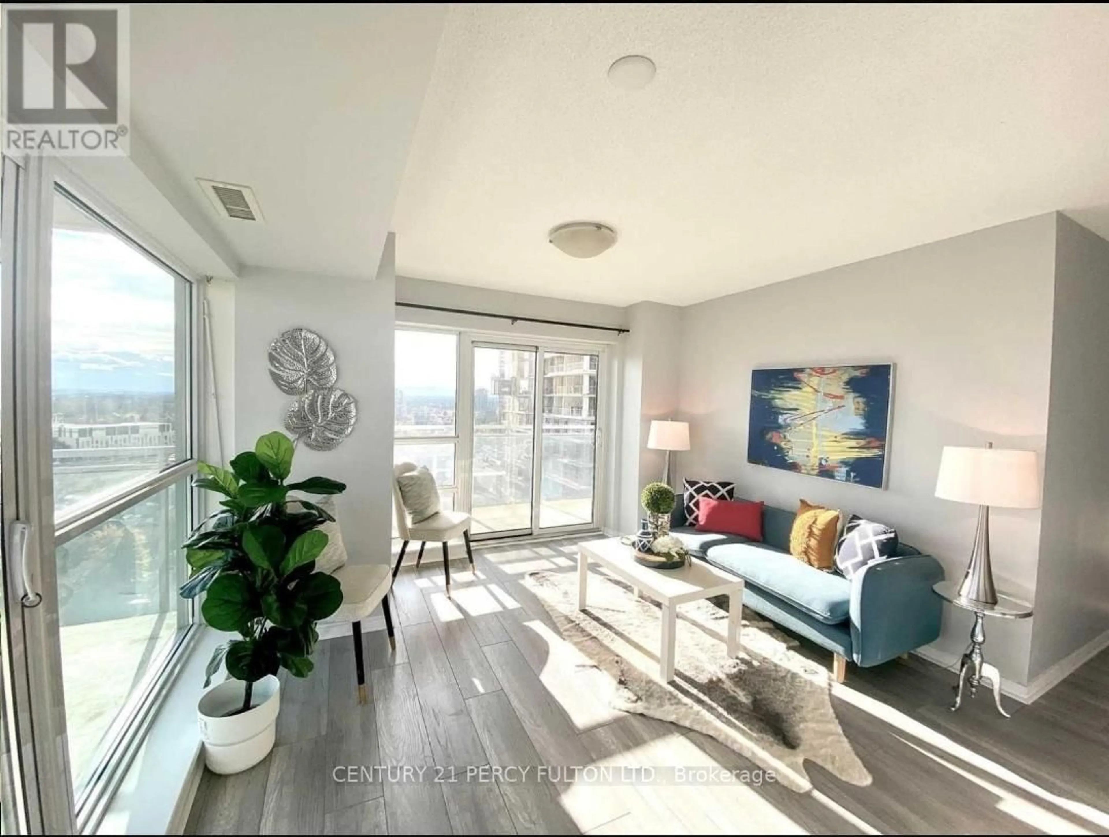 Living room with furniture, wood/laminate floor for 215 Queen St #2003, Brampton Ontario L6Y 1M6