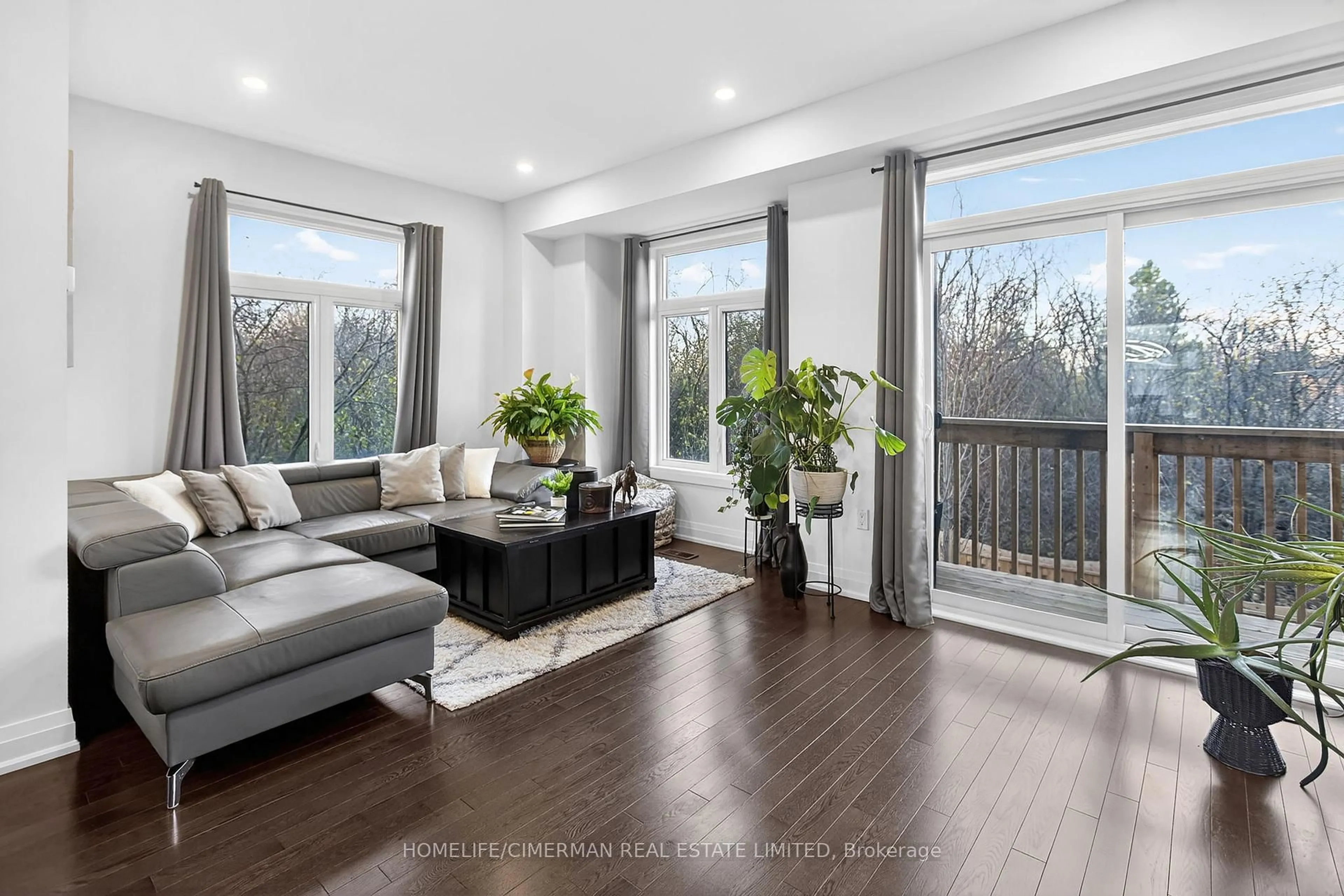 Living room with furniture, wood/laminate floor for 1802 Mitoff Pl, Mississauga Ontario L4W 0E8