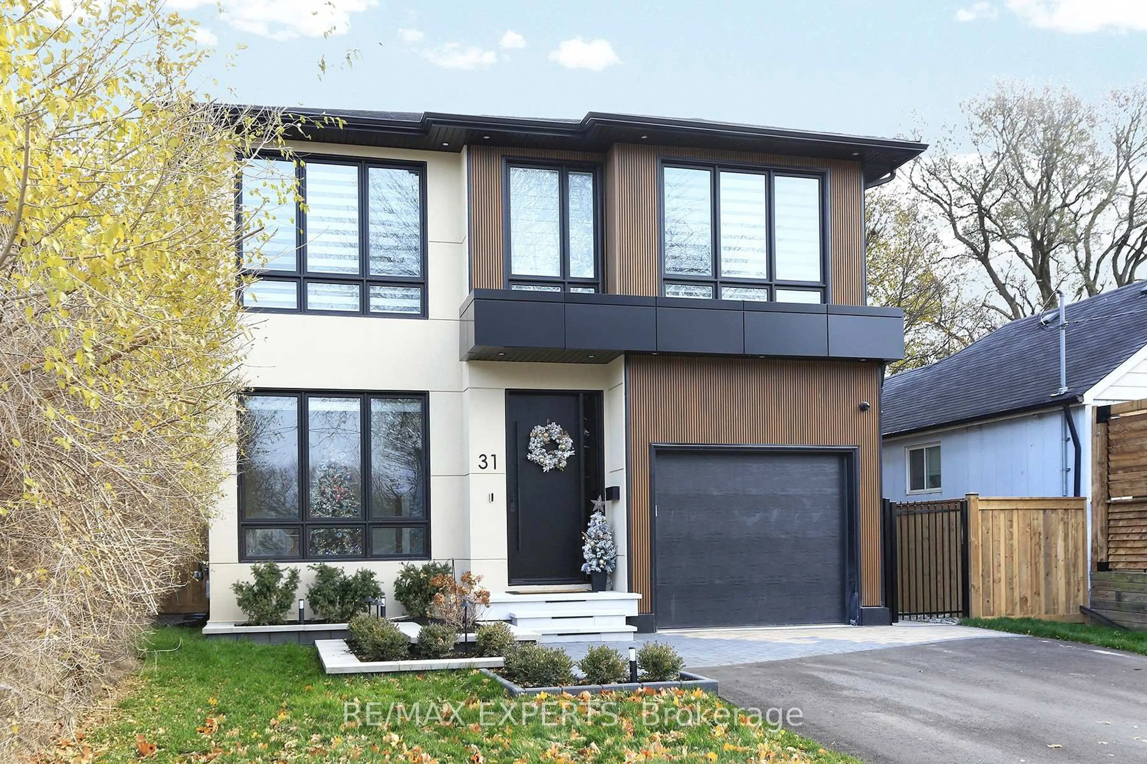 Home with brick exterior material, street for 31 Fulham Dr, Toronto Ontario M8W 4T1