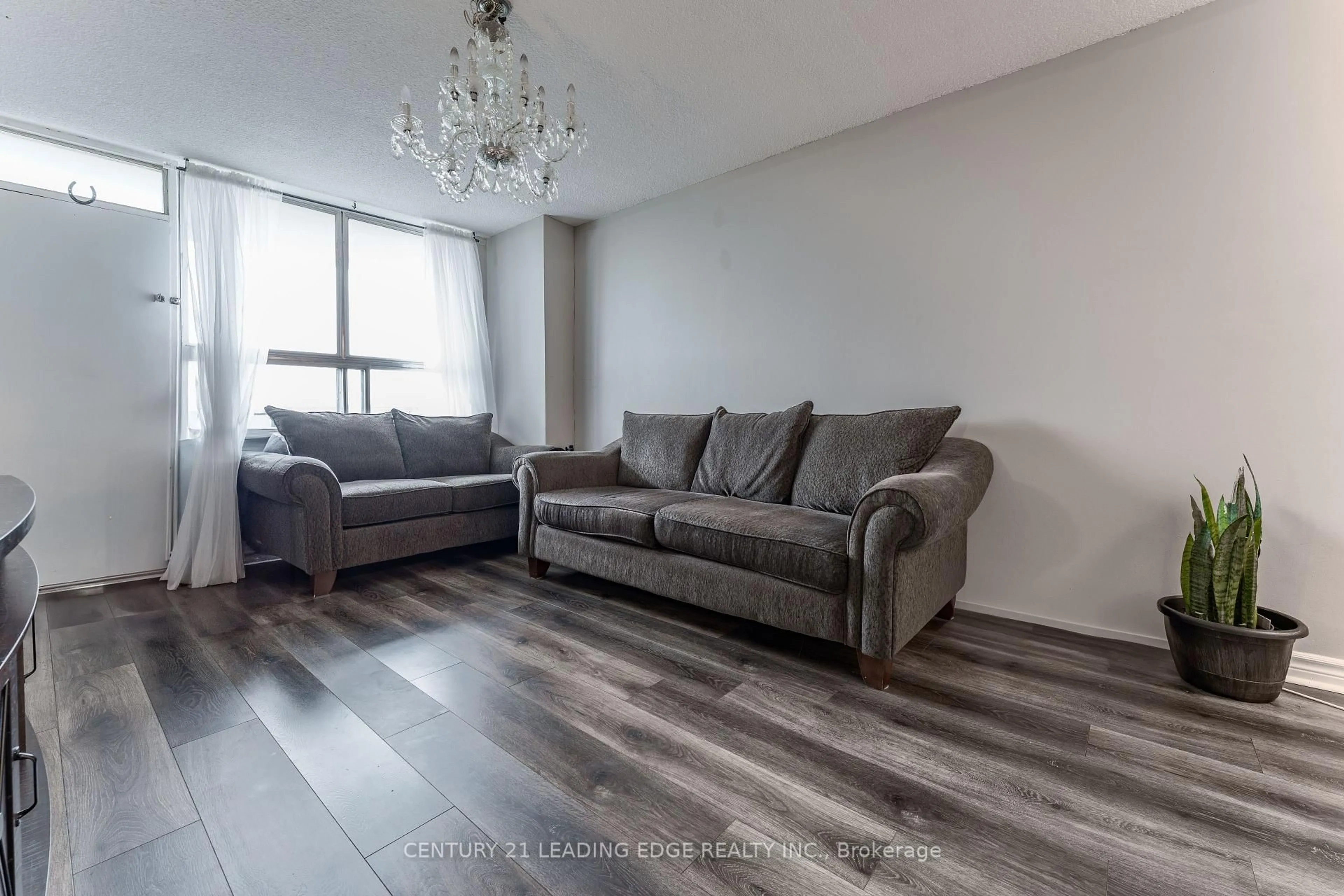 Living room with furniture, wood/laminate floor for 940 Caledonia Rd #611, Toronto Ontario M6B 2G8