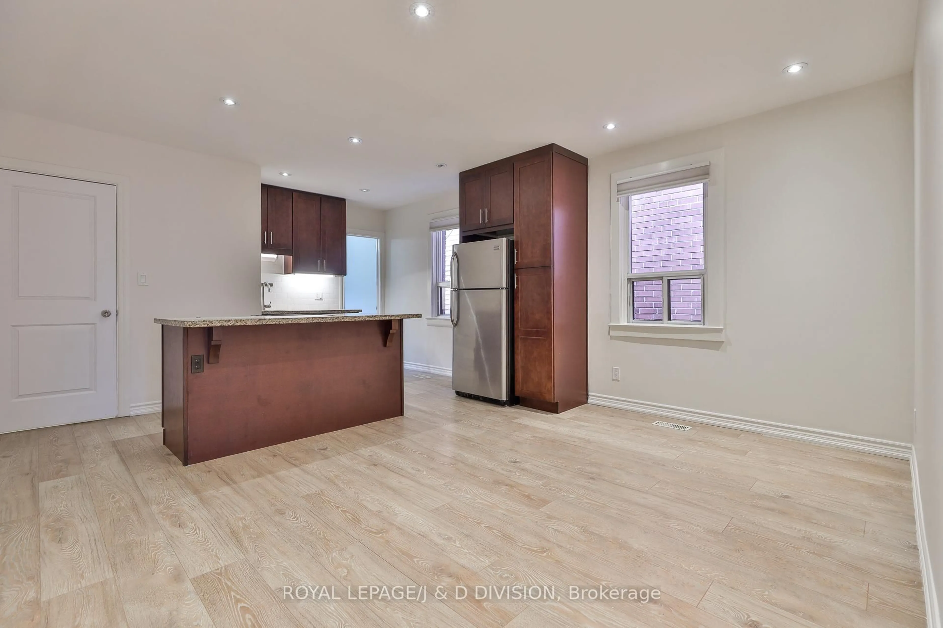 Open concept kitchen, wood/laminate floor for 22 Holmesdale Rd, Toronto Ontario M6E 1Y1