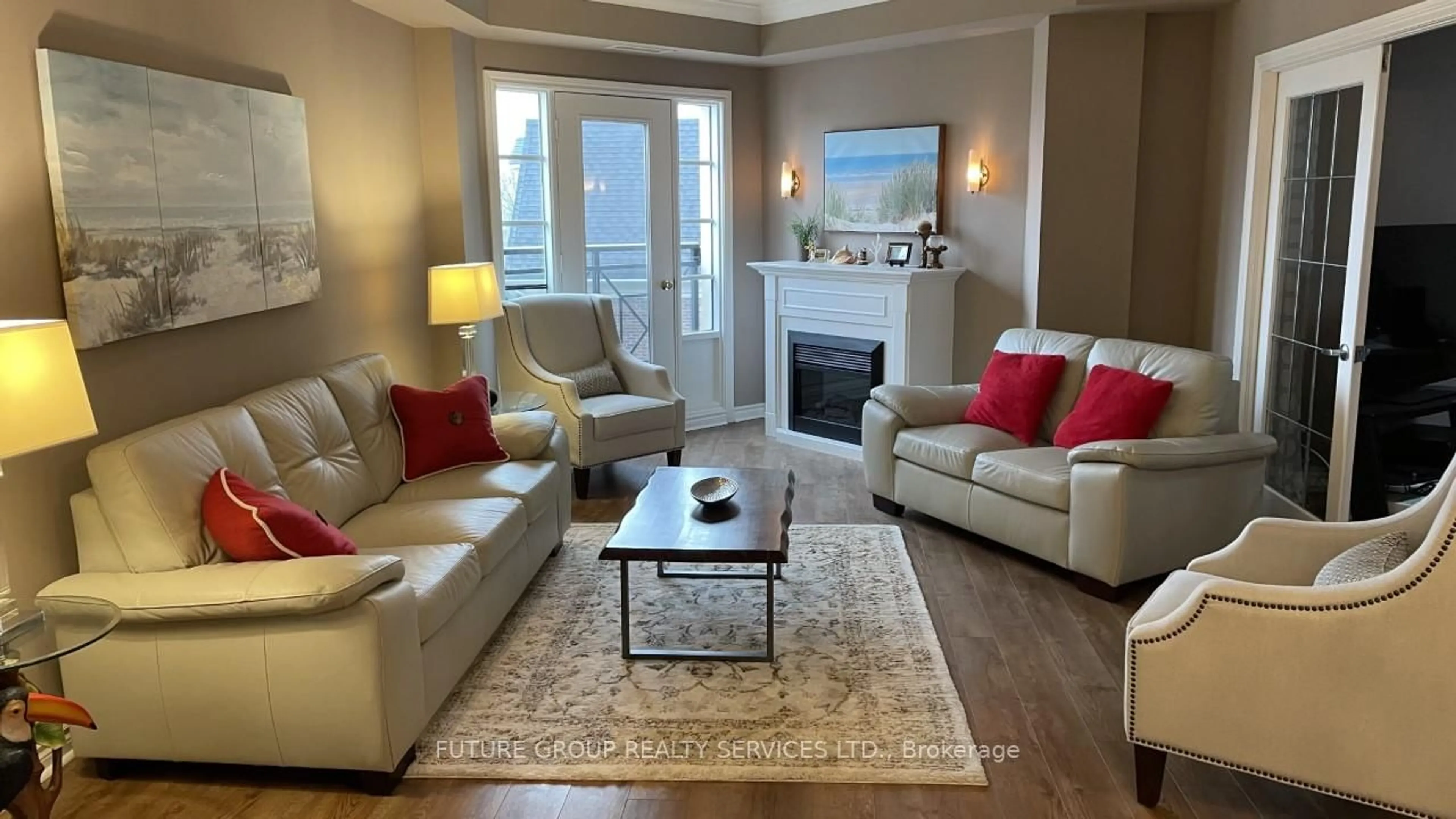 Living room with furniture, wood/laminate floor for 3351 Cawthra Rd #423, Mississauga Ontario L5A 4N5